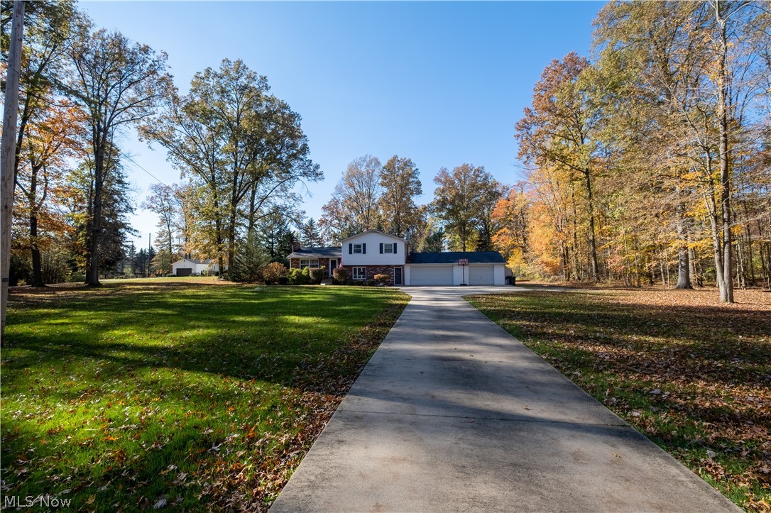 You're going to love this home in Howland Twp and Howland school district just a stone's throw from the golf course at Avalon, quick drive down East Market street to shops and restaurants and easy access to Routes 5, 82 & 11.  With home meaning more now than ever, you'll love the huge yard (almost 1.5 acres) with your own pool and garage space for cars, snow mobiles & toys or use one garage for vehicles and the other for a workshop.  Lots of living space for quiet evenings at home or holiday gatherings.  Many updates include:  living room carpet 2019, remodel of kitchen/dining room 2018, swimming pool & deck 2016, front porch & septic 2014, roof & water heater 2011, concrete drive & upstairs windows 2010, 24'x20' detached garage w/ electric service & water 2005.  Sellers are providing a home warranty to peace of mind.  There's even a connection for a generator.