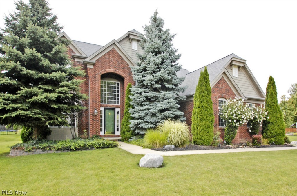Highland Park brick beauty! This home has it all and is located in one of the best locations in Avon! When you first walk through the front door you will know this is your home. There are beautiful all natural hardwood floors in the dramatic two story foyer. Tons of natural sunlight through out the entire home, especially in the great room with its wall of windows over looking the landscaped back yard and huge deck perfect for entertaining. Off of the great room there is even a double sided fireplace going from great room to the private first floor study/library. The kitchen is a chef's oasis with upgraded cabinetry, counter-tops and high end stainless steel appliances. The master bedroom retreat is huge and has vaulted ceilings, tons of windows and an amazing private bathroom with his and hers vanities, and a separate shower and soaking tub and one of the largest closets you will ever see! This home is located directly across from the private development park that is beautifully lands