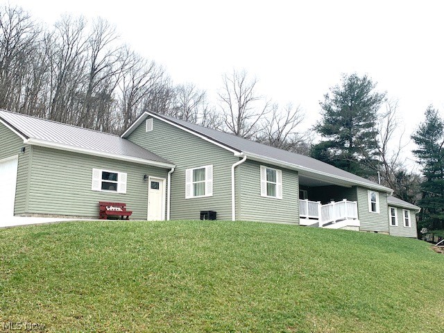 A Very Unique property offering a 3 Bedroom, 2.5 bath ranch home built in 2019. Handicap accessible. Home features 2 large master bedrooms, each with private bath and walk in shower. Great room with vaulted ceiling is open to the kitchen & dining area! Total one floor living with 1/2 bath & laundry room. This home features a separate recreation area with bath accessible through the breezeway. Property also includes a 1998 Single Wide Trailer currently rents for $725/month   
Perfect for additional family members to live in or continue to can be used as a rental property. The home features a large two car garage with concrete driveway and two outbuildings.  Home & trailer are in great condition.