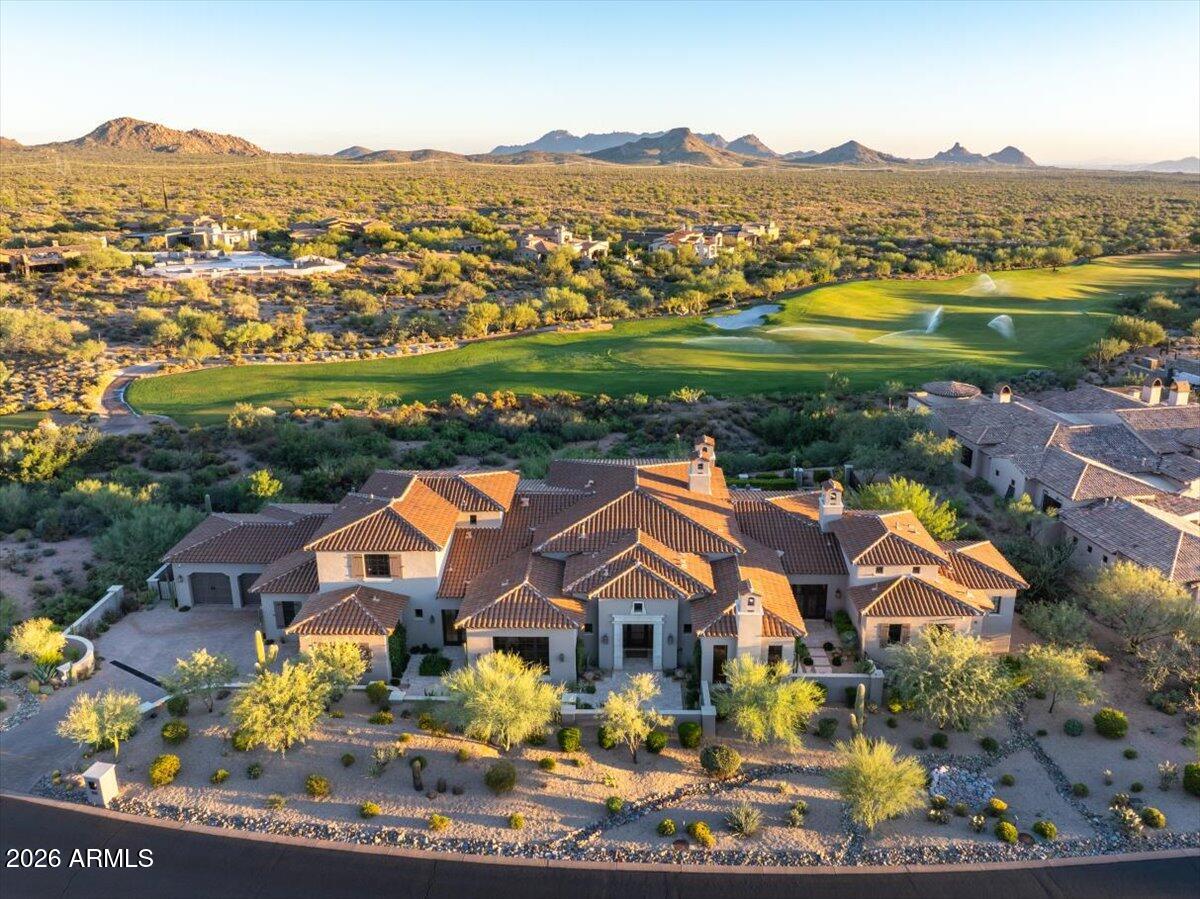 Exquisite Home in the Exclusive Mirabel Golf Club with a Full Golf Membership available to transfer with Board Approval.
Experience refined luxury in this Mediterranean modern farmhouse perfectly positioned along the 13th fairway, with sweeping views of Pinnacle Peak and the McDowell Mountains. Spanning 6,295 square feet, this exceptional residence offers 4 bedrooms and 4.5 baths, including a beautifully appointed attached casita ideal for guests or multigenerational living. Thoughtfully designed with extensive custom features throughout, the home showcases hand-painted tile accents, custom cabinetry, a striking glass-enclosed wine room, and an elegant formal dining space for entertaining. The primary suite is a private retreat, featuring a spa-like bath room with separate his-and-her bathrooms and closets. Timeless architecture meets modern sophistication in a home that seamlessly blends luxury, comfort, and breathtaking desert golf course views. Your guests will enjoy their stay in an attached, separate entrance casita that features a living room, kitchenette and separate bedroom with sweeping views of the fairway and mountains. The home features fully automated systems including shades, full pocket sliding doors, lighting, pool equipment and more from your phone or I-pad.