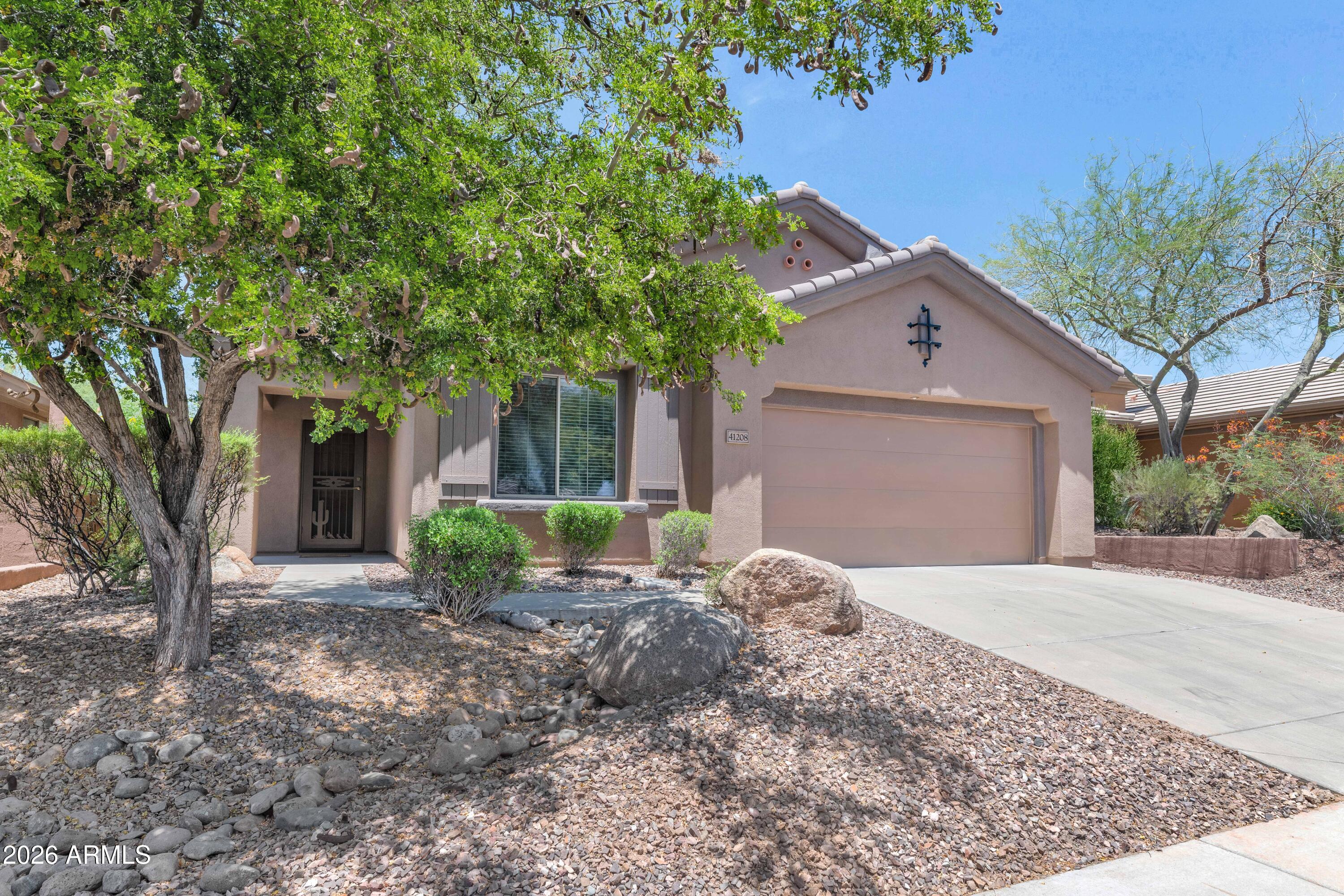 Experience resort style living at its finest in Anthem's award winning, guard gated golf community. This beautifully appointed 2 bedroom, 2 bath home is located in a quieter, sought after area of the Club. Step inside to discover a cozy eat-in kitchen designed for everyday enjoyment, featuring gleaming granite slab countertops, stainless appliances and warm maple cabinetry that blend style with function. Thoughtful details are evident throughout, and best of all, the furnishings are available, making your move effortless.  The outdoor space is perfectly suited to Arizona's sunny days, ideal for relaxing or entertaining under crystal-clear skies. Set within a coveted community known for its beauty and amenities, this home represents exceptional value at an attractive price point. Beyond your front door lies a lifestyle few communities can rival. Anthem Golf & Country Club anchors this vibrant neighborhood with two championship golf courses, two elegant clubhouses, two fitness centers, tennis and pickleball courts, heated swimming pools, and inviting dining venues. Families will delight in nearby water parks and endless recreation. Adventure seekers will love the short drive to Lake Pleasant, where boating, fishing, and scenic shorelines await. Whether you're seeking a full-time residence or a seasonal retreat, this Anthem gem delivers comfort, convenience, and community. See this home today and start living the resort dream.