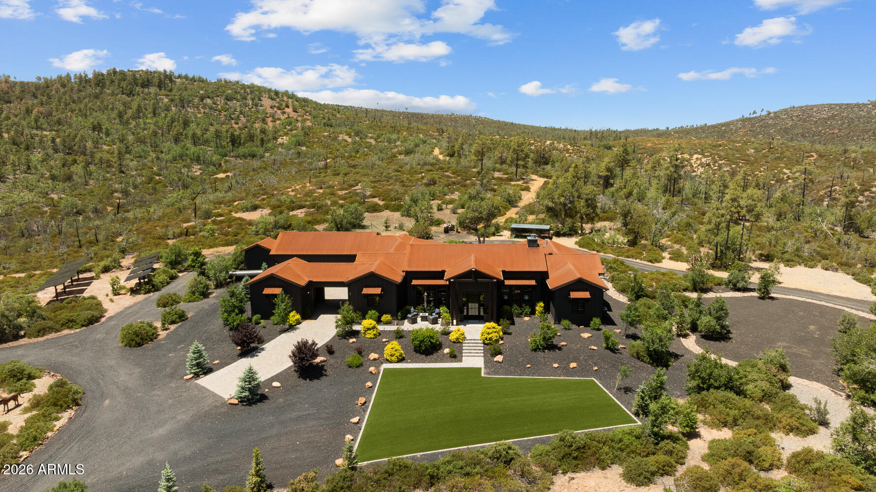 Positioned in the heart of Arizona's White Mountains, this ''Unrivaled Luxury Legacy Estate'' spans 40+ pristine, fully fenced acres surrounded by National Forest with unobstructed panoramic views and absolute privacy. Comprised of three separately parceled luxury residences with private gated entrances, this extraordinary off-grid compound offers a rare opportunity for multigenerational living, executive retreat ownership, luxury ranch living, or an income-producing estate. Current Appraisal $4.1M on just the primary residence. CONVEYS COMPLETELY FURNISHED. The primary residence sits on 25.25 acres and offers nearly 4,000 sq ft of refined single-level luxury featuring expansive windows, dramatic wood-burning fireplace, gourmet chef's kitchen with oversized quartz island Premium appliances, Butler's pantry, water filtration/softener systems, designer lighting, and spa-inspired baths throughout. The luxurious primary suite showcases a soaking tub with chandelier, oversized custom shower, and expansive walk-in closet.

Two newly built luxury residences each sit on 7+ fully fenced acres with private gated access, stunning mountain and forest views, high-end finishes, gourmet kitchens, custom cabinetry, attached garages, and complete off-grid self-sustainability. One residence includes a private attached casita with kitchenette, laundry, full bath, and separate entrance.

Designed for true energy independence, the estate features a sophisticated integrated solar power system, new battery infrastructure, hardwired backup generator, private wells tapping the renowned Coconino Aquifer, Starlink high-speed internet, and each new home has their own brand new septic system.

This truly one-of-a-kind Estate has amenities second to none, with 3 acre turnout pasture, auto-water systems, premium sand round pen, professionally designed 66'x132' arena with retractable watering system, hay/feed storage, tack areas, oversized covered stalls with runs, heated stall waters, and direct gated access to millions of acres of National Forest trails. Additional improvements include a newly constructed gazebo, impressive 50'x60' shop that can hold up to 20 cars with lean-to, RV/equipment storage, integrated pressure washer for your car enthusiasts, and extensive security with remote electric gates throughout.

A truly one-of-a-kind Arizona luxury mountain estate offering unmatched craftsmanship, sustainability, privacy, and direct access to endless outdoor recreation. This remarkable estate may be purchased with all 3 individual properties collectively or individually. See additional details on 491 Fieldy Rd, 539 Fieldy Rd and 512 Fieldy Rd.
