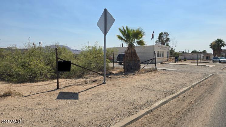 Aguila is the place to be! If you know you know. This is the only commercial land zoned C-3 on Highway 60 in Aguila available for sale. Seller does have other commercial and residential lots available as well. This parcel is situated between the post office and another commercial building on the south side of the US Highway 60. Do your research on Aguila to see why everyone is flocking to this town! Is it the subdivision with an airstrip, custom homes on 5 acre parcels or is it the new roping arenas coming this way? Gorgeous shiny grain silos hint at the large farms in the area. Look out for the Eagle Eye in the mountain too. Option to buy 3 lots behind this lot if you need more space. Do not wait. Put your business here and be ready to grow along with property values!