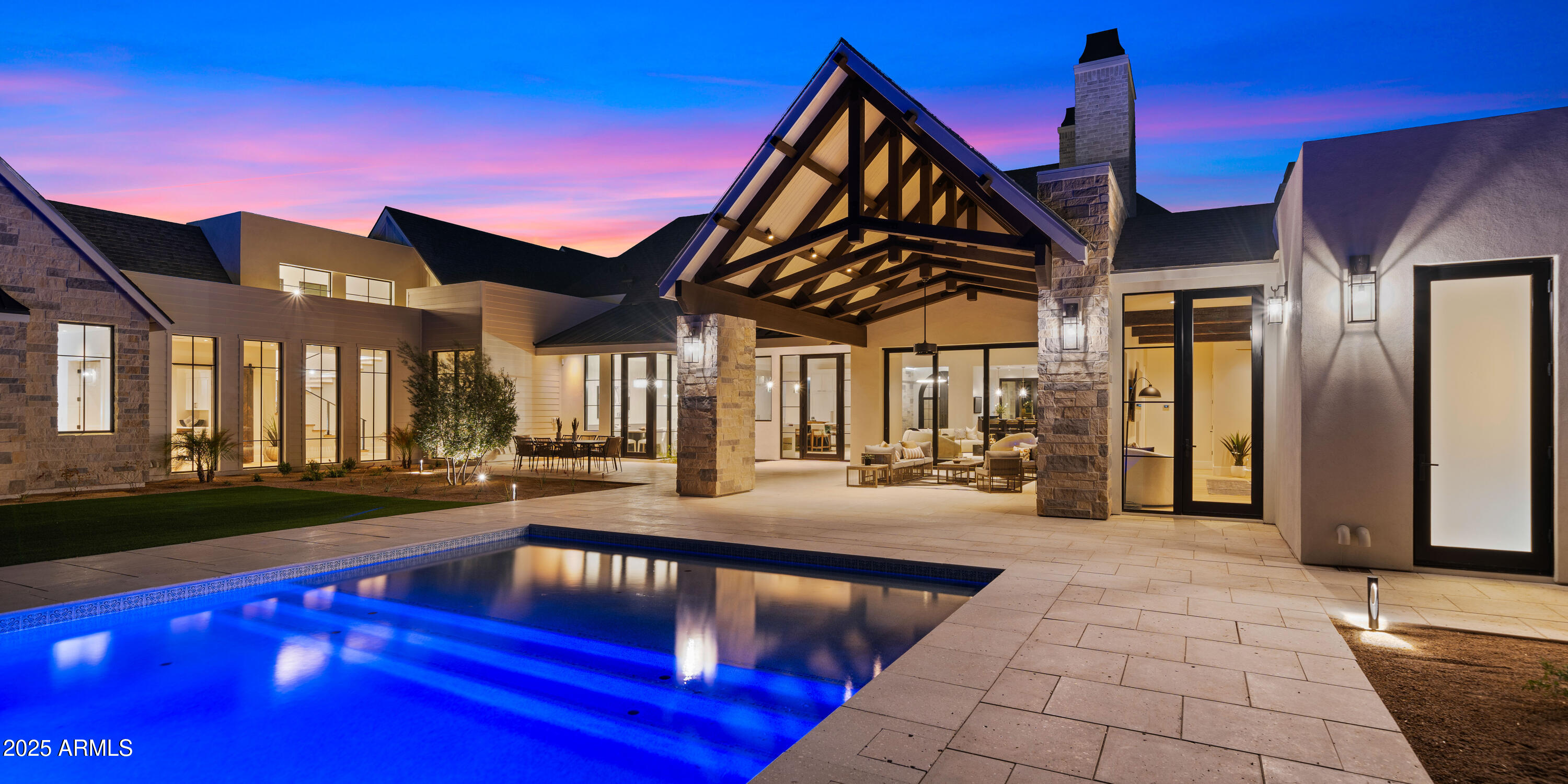 There is luxury, and then there is the Tally Ho Estate. A visionary new build unlike anything else on the market, this architecturally bespoke estate is a masterclass in elevated living. Set on 1.65 acres with horse privileges and unobstructed mountain views, the property captures the soul of Arizona's natural beauty while offering unmatched proximity to dining, shopping, and Sky Harbor Airport. Designed for those who demand the exceptional, the estate blends modern elegance with intentional functionality. Soaring vaulted ceilings with exposed beams welcome you into a sun-drenched great room, where a dramatic fireplace wall and 12-foot pocket doors erase the line between indoors and out. The backyard, framed by Arizona's legendary sunsets, evokes a resort experience all your own. At the heart of the home lies a chef-caliber kitchen curated to perfectionquartz counters, a custom wood-topped island, handmade tile backsplash, dual sinks and dishwashers, and even a built-in dog bowl niche. Every element is as beautiful as it is purposeful. The primary suite is a true sanctuary, offering private backyard access, high ceilings, and a spa-like bath complete with powered dual vanities, dual showerheads, a glass-front linen cabinet, and a walk-in closet with direct laundry access. With four ensuite bedrooms, seven bathrooms, a vaulted office, teen room, flexible bonus space, and a four-car garage, the floor plan flows effortlessly for both family life and refined entertaining. Future plans for a detached casita with a kitchenette, full bath, and private entrance make this home as versatile as it is luxurious. Tally Ho isn't just a home, it's a legacy property. A one-of-one custom estate that embodies urban sophistication, rural charm, and the timeless elegance of the Arizona lifestyle.