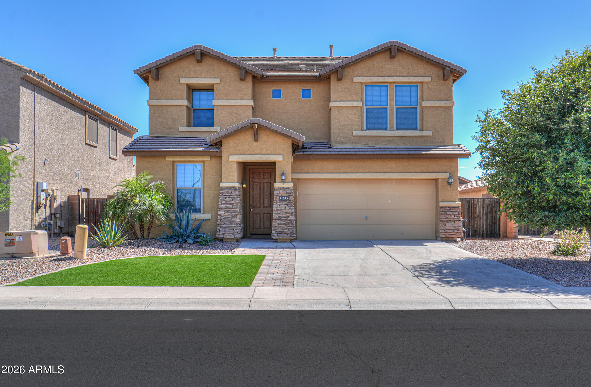 Welcome to the highly sought-after Glennwilde community, offering incredible amenities including two community pools, a fishing lake, children's play areas, bike paths, parks, and more -- all conveniently located near shopping, dining, and schools. This beautiful home has the updating started for you and features new engineered vinyl flooring downstairs, paint, baseboards and stylish new kitchen cabinets. The open-concept floor plan creates the perfect space for everyday living and entertaining, with a spacious Great Room flowing seamlessly into the kitchen and dining area. The kitchen offers an island with corian countertops, pantry, and included appliances including the range, microwave, and refrigerator. Downstairs also features a convenient 4th bedroom and half bath, ideal for guests, a home office, or multigenerational living. Upstairs you'll find a versatile loft/game room, upstairs laundry, and an oversized primary suite complete with dual sinks, separate tub and shower, and a large walk-in closet.
Step outside to the spacious low-maintenance backyard featuring a full-length covered patio -- perfect for relaxing or entertaining year-round in Arizona's beautiful weather.