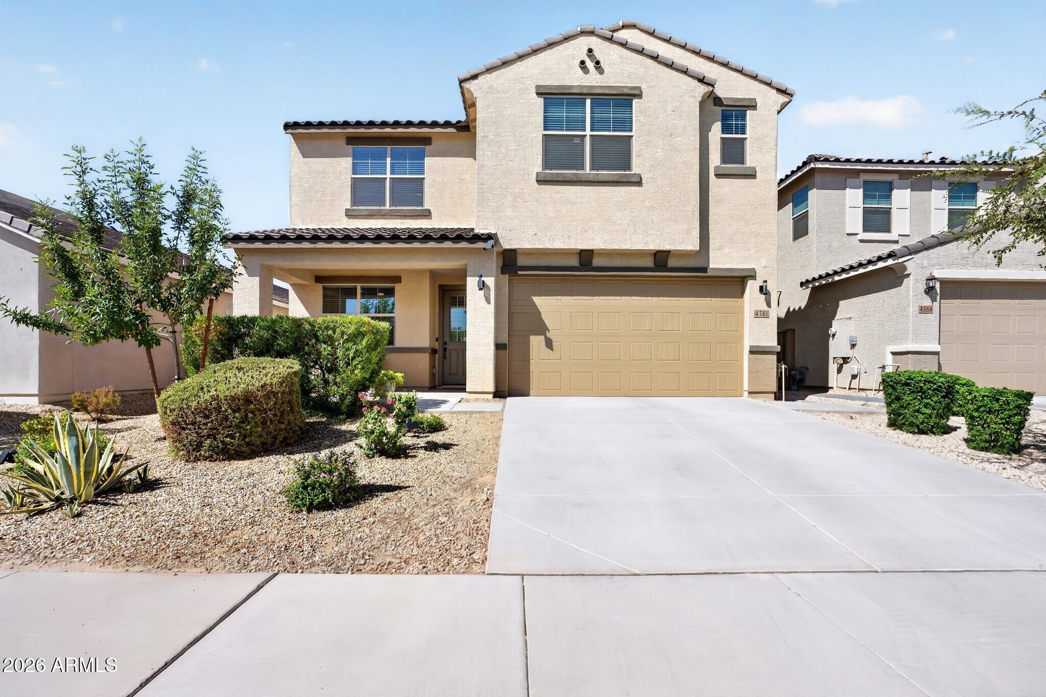 Move-in ready 2023 build! An elegant covered porch and foyer lead to an open-concept layout connecting a light-filled dining area to a spacious Great Room with covered patio. The kitchen shines with upgraded 42'' cabinets in Flagstone stain and beautiful quartz counters. Upgraded tile throughout the living areas, cozy carpet in bedrooms and upstairs. The first-floor owner's suite offers a large walk-in closet and private bath. Upstairs, a bright loft makes the perfect flex space, plus 3 bedrooms and a full bath, 2 with walk-in closets. Step outside to a beautifully finished, low-maintenance backyard with turf, an extended patio, and partial mountain views. Come see it before it's gone!