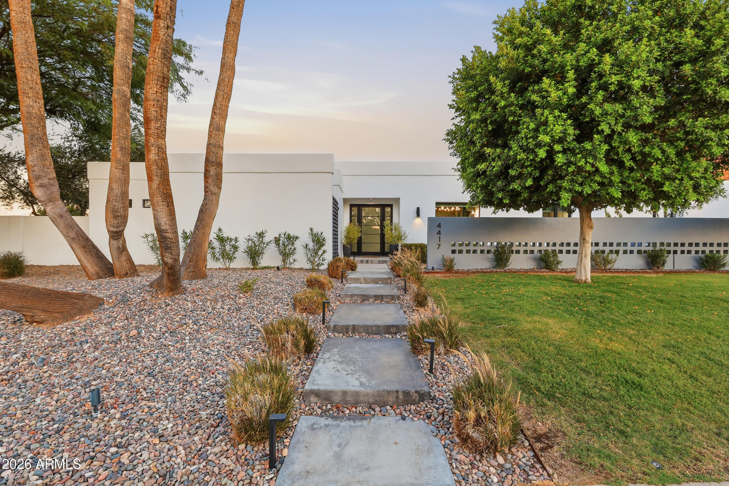 A rare opportunity to own a beautifully renovated mountainside retreat with direct, unobstructed access to the stunning Phoenix Mountain Preserve.
In 2019, the home underwent a comprehensive top-to-bottom renovation, with virtually every aspect of the property thoughtfully redesigned and upgraded. Improvements include new air conditioning, a new electrical panel, plumbing, a fully remodeled chef's kitchen, beautifully redesigned bathrooms, new flooring throughout, updated interior finishes, modern lighting, large guest bedrooms, refreshed exterior spaces, significant pool improvements and extensive landscaping enhancements that transformed the outdoor living experience. The renovation also included an expansion that brought the home's total living space to just under 3,100 square feet. Every room and living space was thoughtfully reimagined with quality craftsmanship, timeless design, and attention to detail, creating a truly turnkey residence.
The resort-style backyard is designed for both entertaining and everyday enjoyment, featuring a sparkling swimming pool, in-ground trampoline, sport court, lush landscaping, and multiple outdoor living areas. Beyond the backyard, direct access to the Phoenix Mountain Preserve offers endless opportunities for hiking, trail running, and enjoying Arizona's spectacular desert scenery.
Adding even more value, the sale includes recently HOA-approved architectural plans for a future luxury expansion and full home transformation, providing a unique opportunity for the next owner to build upon the existing improvements. The approved plans envision a stunning estate of more than 5,000 square feet, allowing buyers to immediately pursue an extraordinary custom expansion without the time and uncertainty typically associated with the approval process.
Ideally located near the Arizona State Route 51, residents enjoy quick access to top restaurants, shopping, entertainment, premier golf courses, and some of Phoenix's most desirable amenities, all while enjoying the privacy and serenity of mountainside living.
Properties offering this combination of extensive renovations, oversized lot, direct mountain access, resort-style amenities, and future expansion potential are exceptionally rare. This is a remarkable opportunity to own a truly special home in one of Phoenix's most coveted locations.
An absolute gem, must see!
Professional photography, architectural renderings, and additional details coming soon.