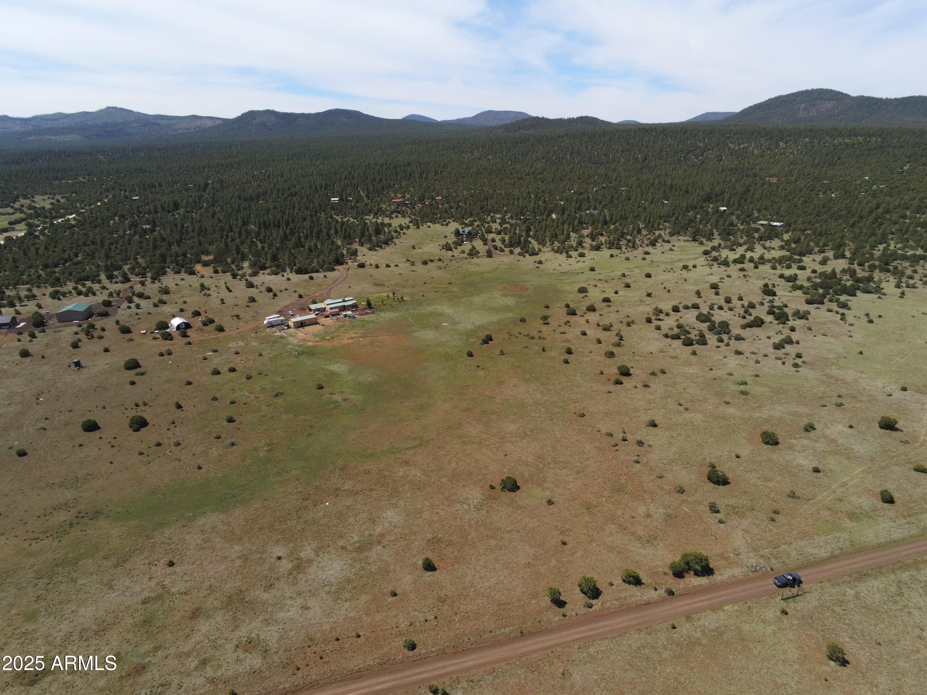 10 Acres with Utilities, Views & Outdoor Adventure in Vernon, AZ Welcome to your opportunity to own a beautiful 10-acre parcel in the heart of Vernon, Arizona! Just 20 mins outside of Show Low. This level lot provides the perfect blend of space, convenience, and natural beauty. With 360-degree views of the surrounding mountains, you'll enjoy Arizona's stunning sunrises, sunsets, and star-filled night skies right from your property. The land is ready for your vision—featuring a shared well and electricity already available at the lot line. Access is easy via maintained roads most of the way, with just a short stretch of a few hundred feet to the property. The terrain is level and highly usable, making it an ideal spot for building your dream home, a weekend getaway cabin, or even a long-term investment property.Nestled in a peaceful setting, this property provides the privacy you desire while still being just minutes from the charming small-town community of Vernon. Here, you'll find the perfect mix of tranquility and convenience. Outdoor enthusiasts will love the easy access to UTV and horseback riding trails leading to Greens Peak, as well as scenic backroads to Pinetop for live music or shopping and dining. Whether you're looking for adventure, relaxation, or a little of both, this property delivers. Don't miss this chance to own acreage with utilities, incredible views, and endless potential in one of Arizona's hidden gems!