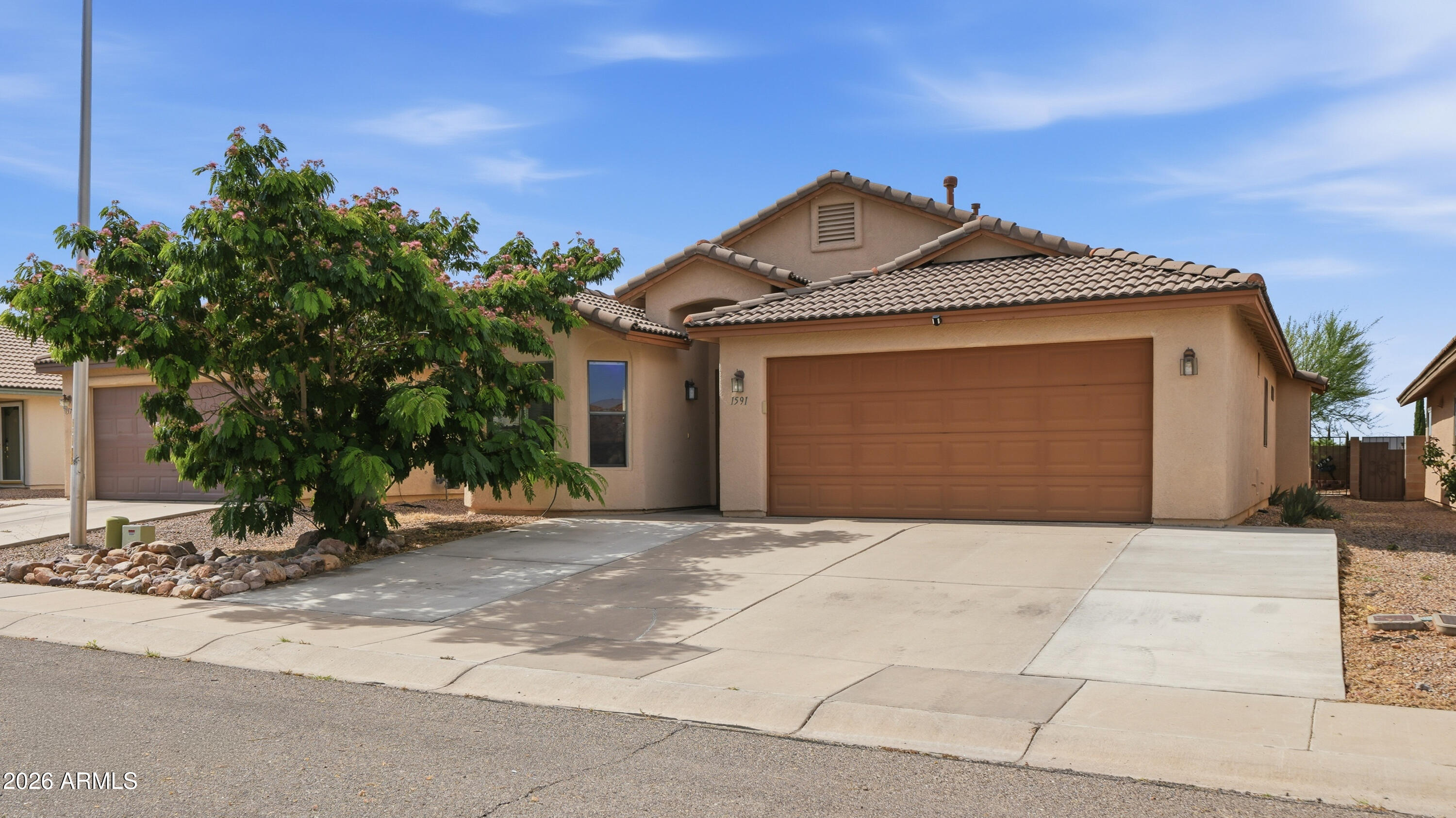 Welcome home to this beautifully maintained, move-in ready 3-bedroom,2-bath home offering 1,683 sq. ft. of comfortable living built in 2007. The bright open layout creates an inviting flow, centered around a cozy fireplace perfect for relaxing or entertaining. The kitchen features stainless steel appliances, a built-in microwave, and ample cabinetry for easy storage. Washer and dryer convey for added convenience. The spacious primary suite offers a walk-in closet and a relaxing garden tub. Step outside to a private, low-maintenance backyard ideal for quiet mornings or weekend gatherings. Conveniently located near shopping, dining, parks, and daily essentials, this home blends comfort and ease in a welcoming setting.A wonderful opportunity you won't want to miss-schedule your showing today!
