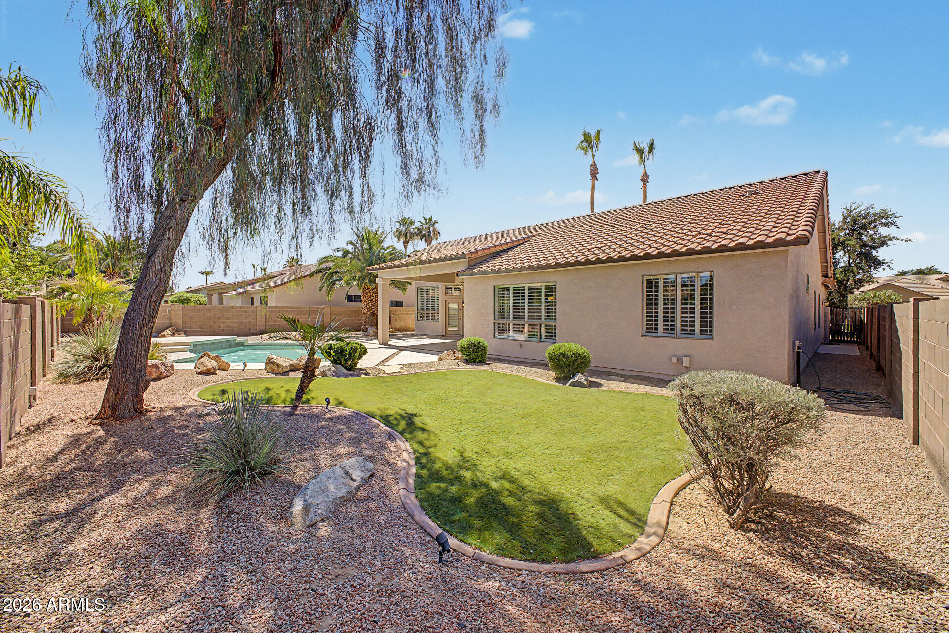 Don't miss this outstanding property! One of the nicest homes in the highly sought after lake/golf community of Ocotillo. This home has been meticulously cared for and updated beyond your expectations! This 4 bed 3 bath home includes a den/office/additional bedroom has a Gorgeous fully remodeled kitchen with top of the line cabinets, granite counters, 24'' travertine flooring and real hardwood floors. Primary bathroom is absolutely beautiful with a snail shell shower and huge walk in closet. Plantation shutters throughout. Exterior paint 2026. Private, manicured backyard complete with refreshing pool, mature landscape and north facing with no homes directly behind. Award winning school and shopping within walking distance. New in 2021 Tankless hot water heater , A/C Water softening system.