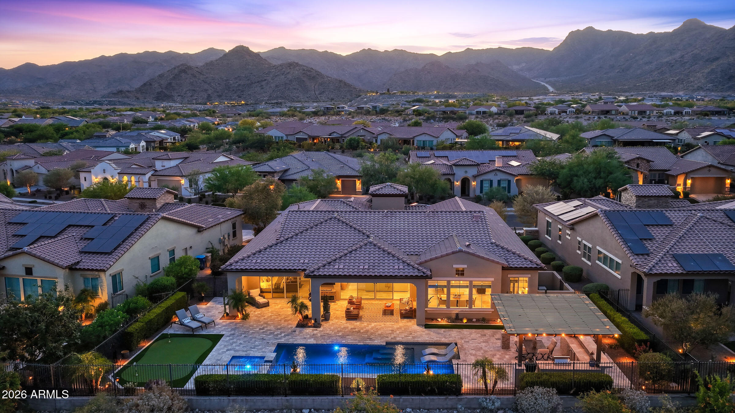 Experience the pinnacle of active-adult living in this stunning David Weekley ''Serendipity'' model, perfectly positioned within the prestigious 55+ community of Victory at Verrado. Situated on the 13th fairway of the Victory Course, this home offers an unparalleled backdrop of panoramic mountain vistas, twinkling city lights, and manicured greens.

With over $400,000 in custom upgrades every inch of this 3-bedroom, 3.5-bathroom plus den home reflects meticulous attention to detail. The chef's kitchen is a true showstopper, featuring an oversized quartz island, professional-grade appliances, and elegant over-cabinet lighting. A large butler's pantry transitions seamlessly into an expansive walk-in pantry, providing exceptional storage and prep space. The interior's custom features flow effortlessly outdoors through massive sliding glass doors, revealing an entertainer's paradise. Relax in the heated spa, swim in the oversized pool, or host guests under the shade of the pergola at your fully equipped outdoor kitchen and built-in BBQ.

Living in Victory means more than just a beautiful home; it's about a vibrant lifestyle with exclusive access to the Victory Club, community pools, and miles of scenic trails. Complete with fresh exterior paint in March of 2025 and a 3-car epoxy garage with extensive built in cabinets and plenty of overhead storage, this home offers a rare opportunity for luxury and connection.

For a complete list of high-end features and finishes, please see the upgrades list in the documents tab.