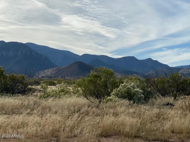 Amazing views of the Huachuca Mountains. Rare one acre lot, SW corner with building pads already in place. 1/4 Well Share, nice gravel road. Elbow room but an easy trip to town. Come enjoy Arizona's finest year round weather.