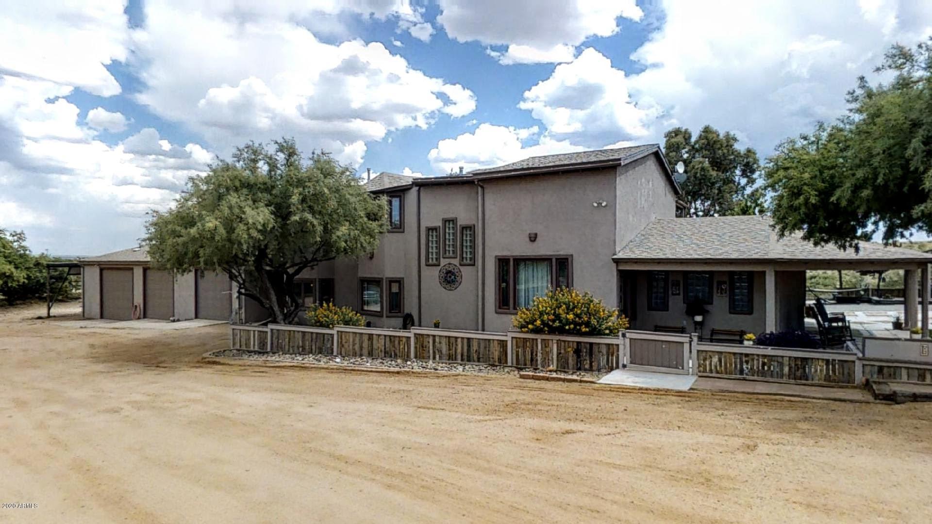Beautiful custom built home on almost 5acres! Perfect home for a large family, this two-story 4bedroom/3bathroom home offers something for everyone. Large great room, updated gourmet kitchen with stainless steel appliances, formal dining room, two separate living rooms and a game room. Extra rooms downstairs could be used as MIL suite or hobby/craft room. All bedrooms are located upstairs with bay windows in every bedroom. New carpet throughout.  Master bedroom with south facing balcony. Park like backyard landscaping with lush grass and mature trees compliment the mountain views. Huge outdoor entertaining space with 2 ramadas, outdoor kitchen, greenhouse and wraparound porch.  Large oversized garage with ample storage space and large workshop. RV parking with full RV hookups.