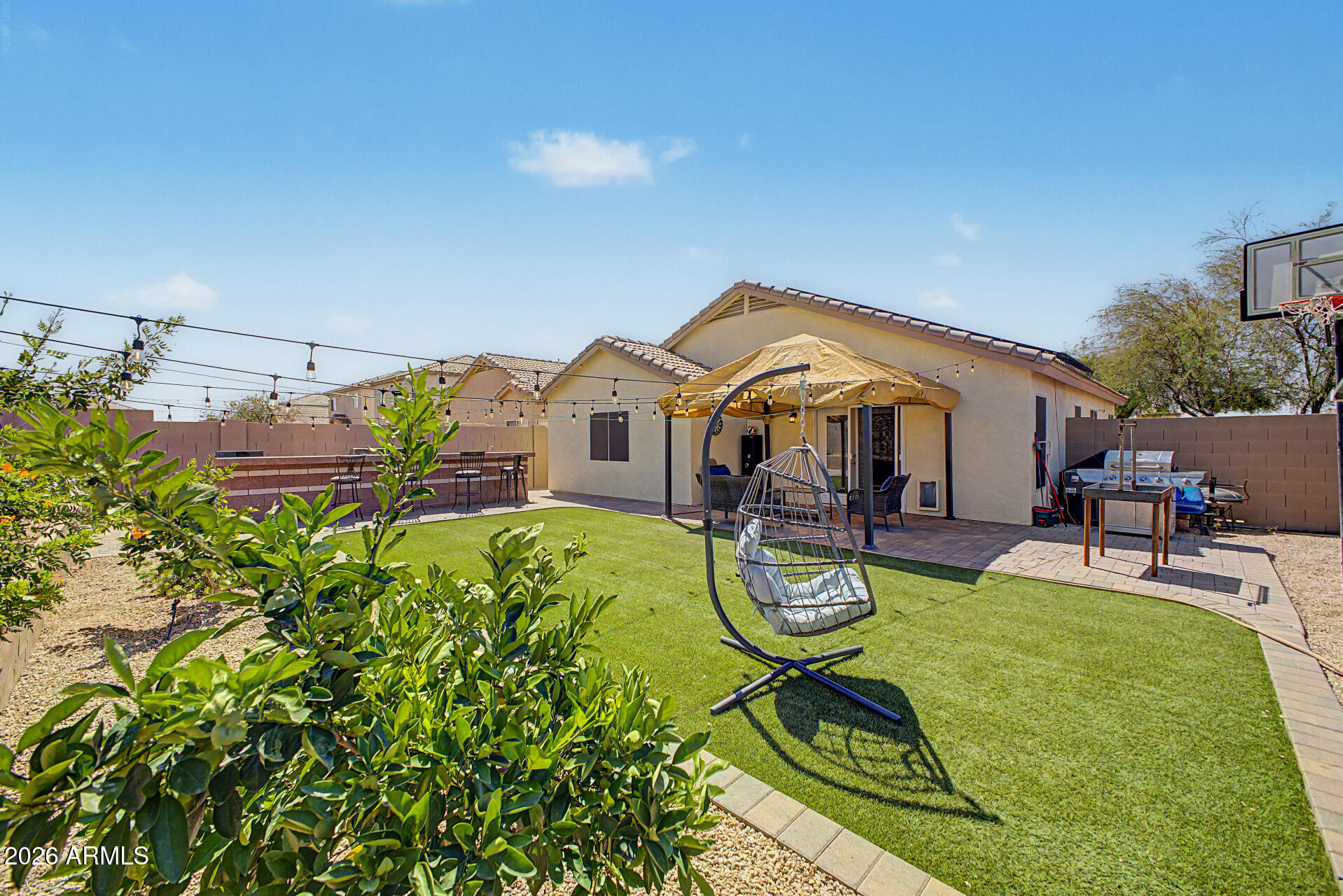This charming single-level residence, nestled on a corner lot, is the one! Offering 3 beds, 2 baths, a 2-car garage, RV gate, and a low-care landscape. The inviting interior features a neutral palette, wood-look tile flooring in common areas, soft carpet in bedrooms, and tons of natural light. You'll love the formal living room paired with French doors to the back! The eat-in kitchen boasts recessed lighting, ample white cabinetry w/crown molding, and built-in appliances w/SS gas range. Enter the main bedroom to find two closets and a private bathroom with dual sinks. Perfect for relaxation and gatherings, the large backyard showcases a built-in BBQ grill, well-laid pavers, artificial turf, a storage shed, and fruit trees.