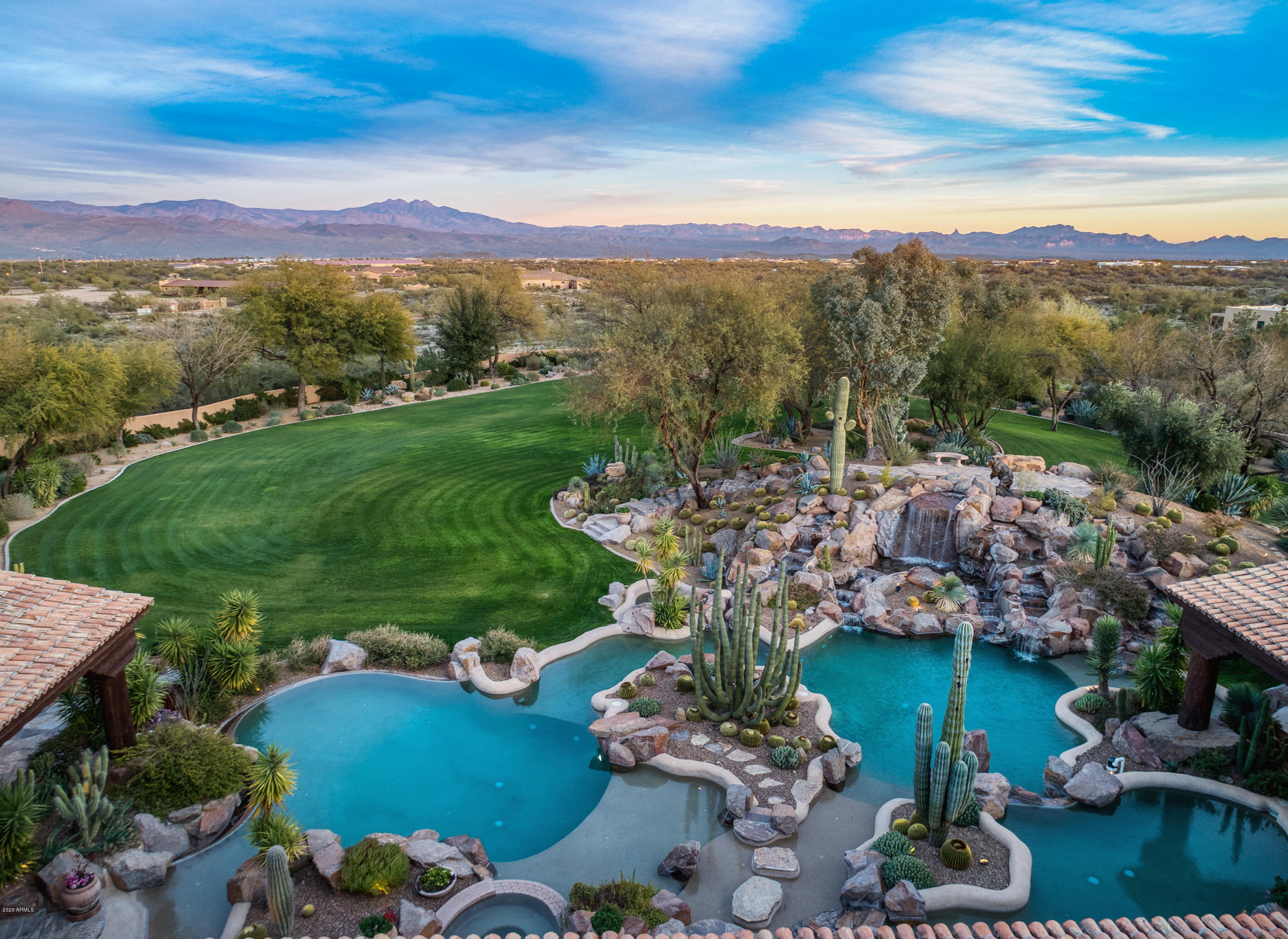 Priced Reduced ... Opportunity Knocks!!  --- 
5-star RESORT you can call home.  15.5 acres of opulent privacy make this estate the perfect luxury retreat.  With resort-style pools, enticing water features, a state-of-art kitchen, climate-controlled wine cellar, spacious game room and 2 fully-appointed wet bars, this home is an entertainer's paradise!  Treat your guests like absolute royalty with luxurious en-suite accommodations.  Enjoy a hobbyist's lifestyle with a 4-car garage, fully-equipped workshop, workout room, putting green, and even a one-acre+ model railroad that is a must-see!  Ten minutes from world-class golf/country clubs, fine dining, hiking trails and renowned horse trainers and equestrian facilities. Call today for your private tour! Be sure not to miss the Matterport 3D floor plan / doll house and virtual walk-through provided for a full tour of this amazing property!