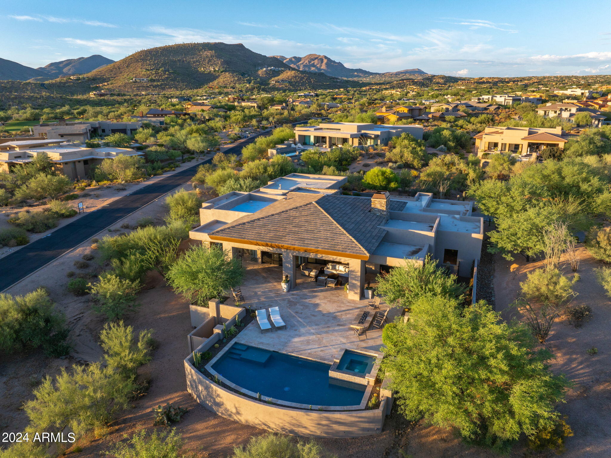 Golf Membership Available. Nestled the serene neighborhood of Desert Mountain this modern home, constructed in 2018, invites you to experience a blend of luxury and comfort with its thoughtfully designed open great room floor plan. The seamless integration of living, dining, & kitchen spaces creates an inviting atmosphere perfect for entertaining and everyday living.

As you enter the home, you're greeted by an abundance of natural light that flows through large windows, highlighting the exquisite finishes & contemporary design. The home features five spacious bedrooms, each offering a tranquil retreat with ample storage and stylish decor. The primary suite is a sanctuary of its own, complete with a luxurious en-suite bathroom featuring a spa-like shower and a generous walk-in closet. The expansive patio is the crown jewel of this residence, designed for those who appreciate outdoor living at its finest. Imagine hosting unforgettable gatherings with family and friends around the built-in BBQ, taking refreshing dips in the sparkling pool, or unwinding in the spa while watching the sunset on the horizon, painting the sky with breathtaking colors.

This home is truly turnkey, ready for you to move in and start creating memories without the need for updates or changes. Furthermore, a Golf membership is available for transfer, offering access to exclusive courses and amenities that enhance the lifestyle of this remarkable community.

Experience the perfect balance of modern elegance and laid-back luxury in a home where every detail has been meticulously crafted to elevate your living experience.