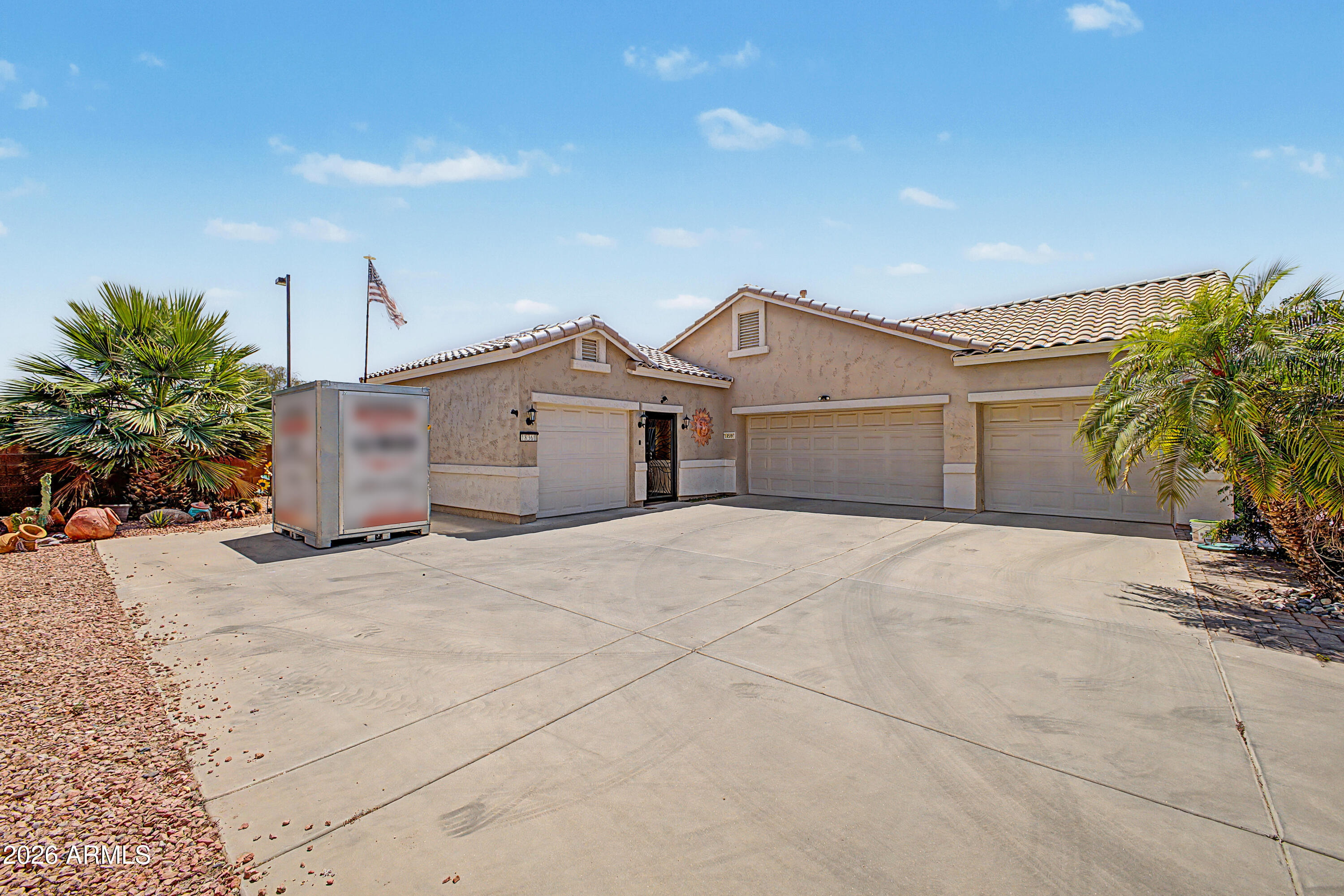 4 CAR GARAGE ALERT!! Yes this home has been upgraded with a 4th car garage for that toy you have been thinking about buying or already have and need the space to keep right at home. The home itself has many upgrades including a full width patio extension in 2022 with the 2 wall mounted TV's included, all carpet replaced with tile floors in 2023, Trane HVAC in 2024, entire backyard redone in 2024 with pavers and turf, new wood plantation shutters and roll up shades in 2023, new 2nd bathroom shower installed replacing tub, new garage door openers in 2025, new water heater in 2021, and a heater rated fireplace to give you real usable heat for some of those cooler Arizona winter nights. There is also a new security gate between the new garage and the front door for added privacy and security. The great room has all tile floors, vaulted ceiling, a ceiling fan and a heater rated gas fireplace that gives off real heat for those chilly winter days and nights. The nearby eat-in kitchen features a large island for eating that quick meal, built-in wall oven and microwave, separate cooktop, pantry and ample cabinet space for storage. The master bedroom has vaulted ceilings, tile floors and a wall mounted TV included. Master bathroom has double sinks, a step in shower with grab bars, a walk-in closet and a private toilet room. Second bedroom has all tile floors as well as a wall mounted TV included with updated bathroom real close with a new step in shower instead of a tub. There is a den/office also that could possibly be converted to a bedroom in the future. Large laundry room with lots of upper and lower cabinets and plenty of counter space for laundry day. All the garage floors feature epoxy coatings, and the new 4th car garage has a wall mounted TV and air conditioning, so working out there in the summer will be a breeze. There also is a solar transfer station wired into the main electrical panel to generate and store solar power to use in case of a power outage. The backyard has been upgraded with extended width and depth covered patio with 2 wall mounted TV's included, 3 ceiling fans, new pavers, new turf, multiple seating areas, cool decking, putting green on the side yard as well as a storage shed. There also is a great view of the White Tank Mountains from the kitchen and the back covered patio that will never get old. Enjoy everything that this great upgraded home has to offer in this resort style community with golf, swimming, activities and the lifestyle and privacy you are looking for.