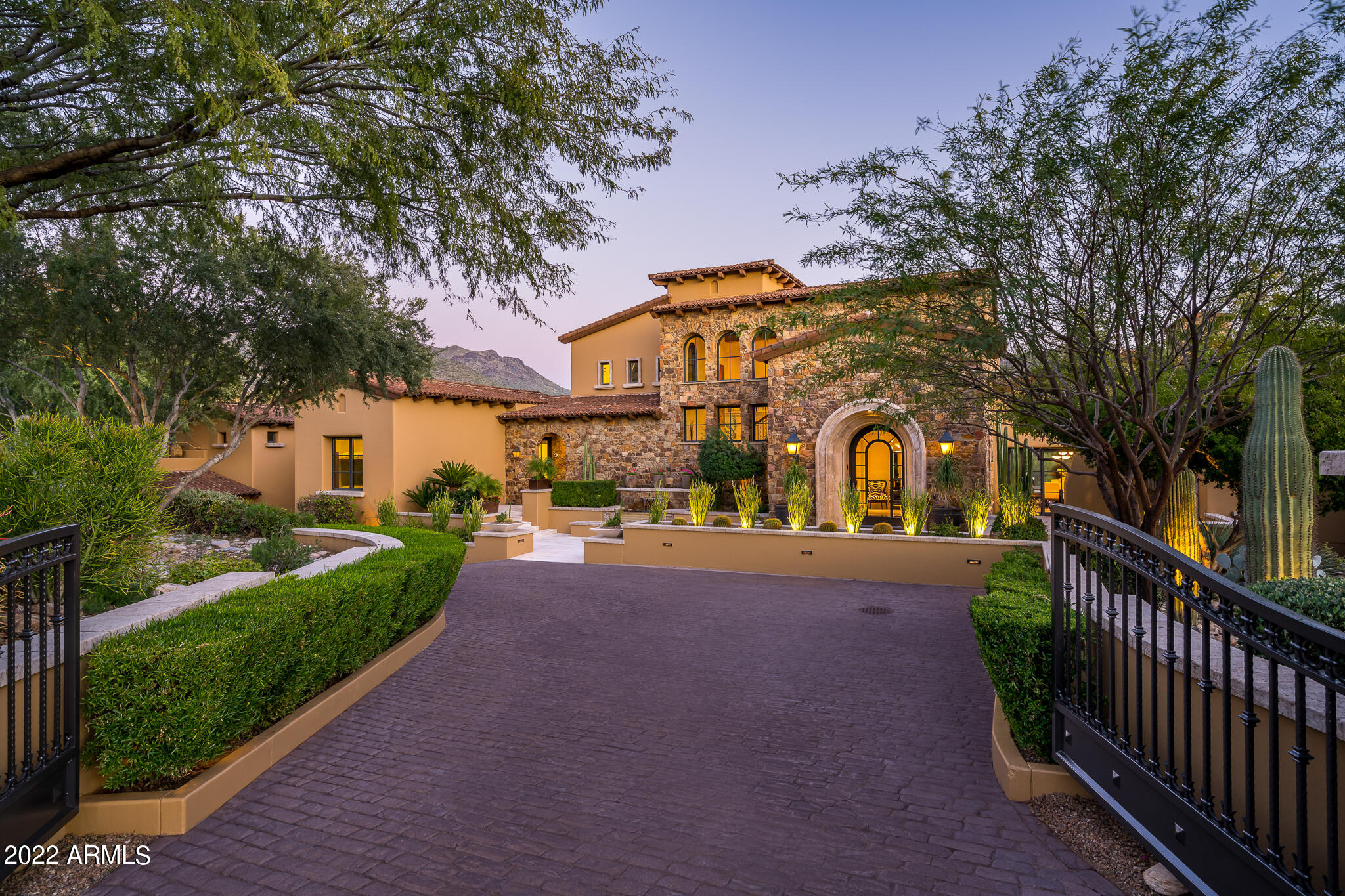 This extraordinary, 15,009 square foot home offers something for everyone! Expansive views that encompass the eighth fairway and green of the Silverleaf golf course, mountains, desert AND city lights! With its 6 bedrooms, including a 2-bedroom guest house & full caretaker's cottage, 3 laundry facilities, 11 bathrooms (full and half), its ideal for entertaining large groups or cozy nights spent in the theater room. The gourmet kitchen features a massive double island, butler's pantry and provides the option to eat-in or serve a sumptuous meal in the formal dining room. Other impressive features include the living room, family room, two spacious offices, bonus room, entertainment room, wine cellar with tasting room, 6 fireplaces, and a 7-car garage including a separate car wash bay! More.... This home allows the opportunity for amazing indoor/outdoor living and dining, including covered patio and a sparkling heated pool and spa, fireplace & fire features and a zen garden; all a perfect backdrop for entertaining in our magnificent Arizona sunshine! No detail was overlooked in this phenomenal home. Make a point to see it for yourself!