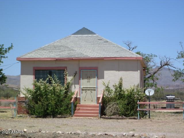 Investor opportunity or fix up this cute little place and make it your own! Original wooden floors that could be beautifully restored. SO much potential! This 2 bedroom/1 bathroom home has 3 outbuildings to use at your discretion. One is large enough to park an RV! All have concrete floors and some have connections for an air compressor. This property is fully fenced and there are 2 electric meters on the premises. Call for a private tour and view it today!