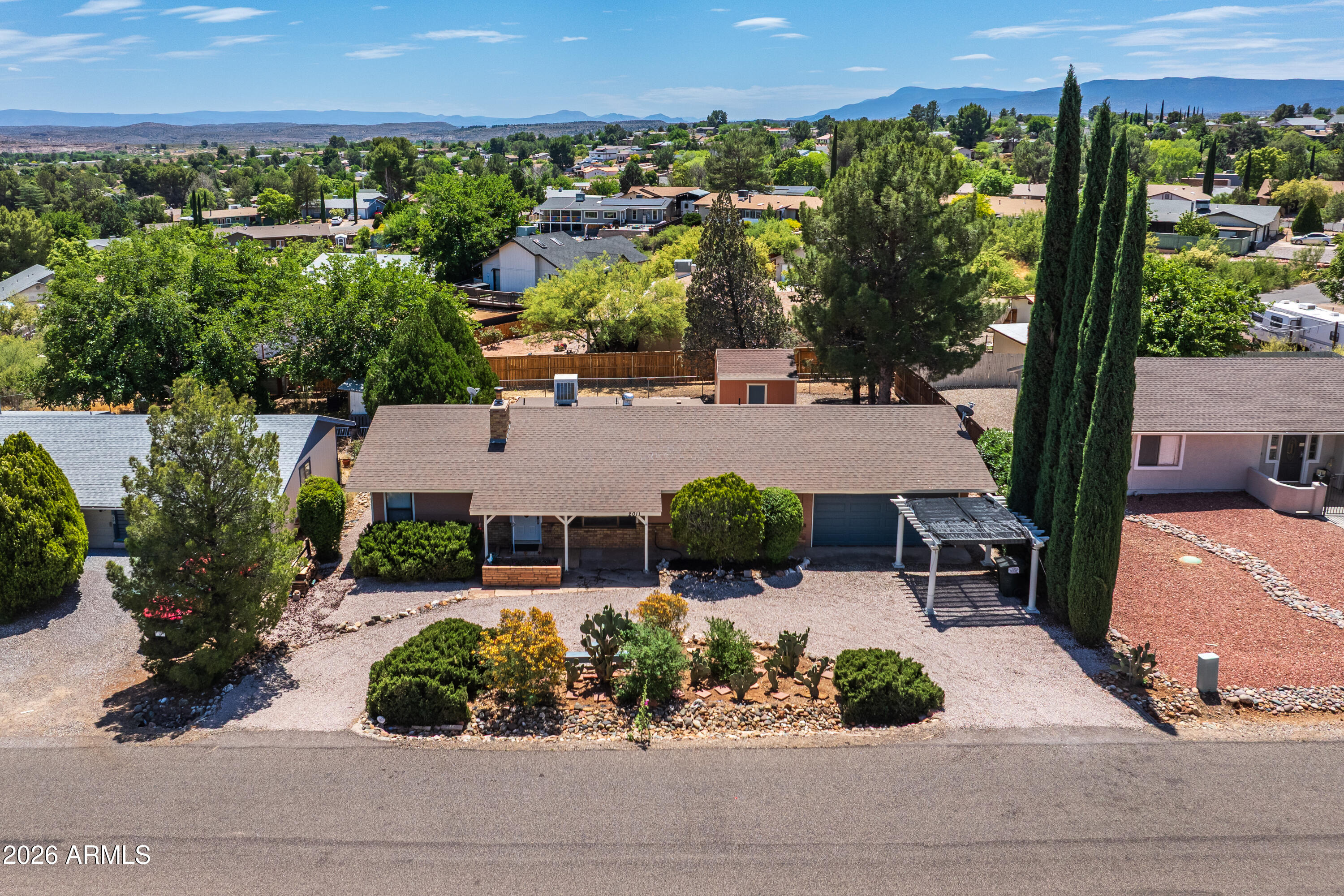 Single level home with a split floor plan, offering a layout that's both functional and comfortable in a quiet Cottonwood neighborhood. With generous room sizes and multiple living areas, there's plenty of space to spread out and make it your own.

The main living area is open and welcoming, centered around a cozy fireplace and flowing easily into the dining space and kitchen. It's a great setup for everyday living and easy entertaining. Just off the kitchen, a bright dining nook brings in natural light and creates a casual place for meals or morning coffee. The primary suite is nicely sized and set apart for privacy, featuring dual closets and an ensuite bath with an extended vanity and separate shower area. On the opposite side of the home, the additional bedrooms are well proportioned and share a full bath, making the split layout ideal for guests, family, or a home office.

An added Arizona room provides valuable extra space and flexibility. Whether you're looking for a second living area, hobby space, or a place to relax, it's a feature you'll appreciate year round.

The home also includes a dedicated laundry room with access to the attached garage, along with good storage throughout.

Out back, a covered patio offers a great place to unwind or entertain, with space to enjoy the outdoors and create your own setup. There is a large shed with electric thats great for storage or extra room for a hobby. 

Come see this charming home!