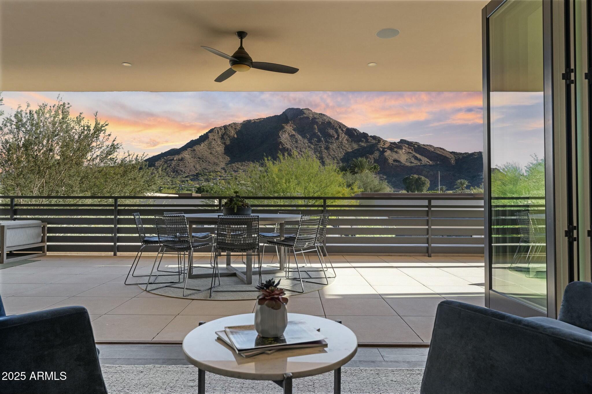 OFFERED FURNISHED! Welcome to 5527 E Arroyo Verde, a stunning property in the Villas at Mountain Shadows, Paradise Valley, AZ. This luxurious home offers unobstructed south-facing views of Camelback Mountain and features hardwood floors throughout. The spacious open floor plan includes a private elevator, Wolf and Subzero appliances, and a Savant home automation system with motorized window coverings. Enjoy a wine room, a lavish primary suite with a coffee bar, spa-like bathroom, and custom closet. The oversized guest bedroom, 3 bathrooms, and 2-car garage ensure comfort and convenience. Retractable folding doors open to a large patio with a gas fireplace, outdoor TV, and dining areas. Full access to the Mountain Shadows Resort, including pools, gym, spa, discounts on roo food, beverage, and golf completes this turnkey home.