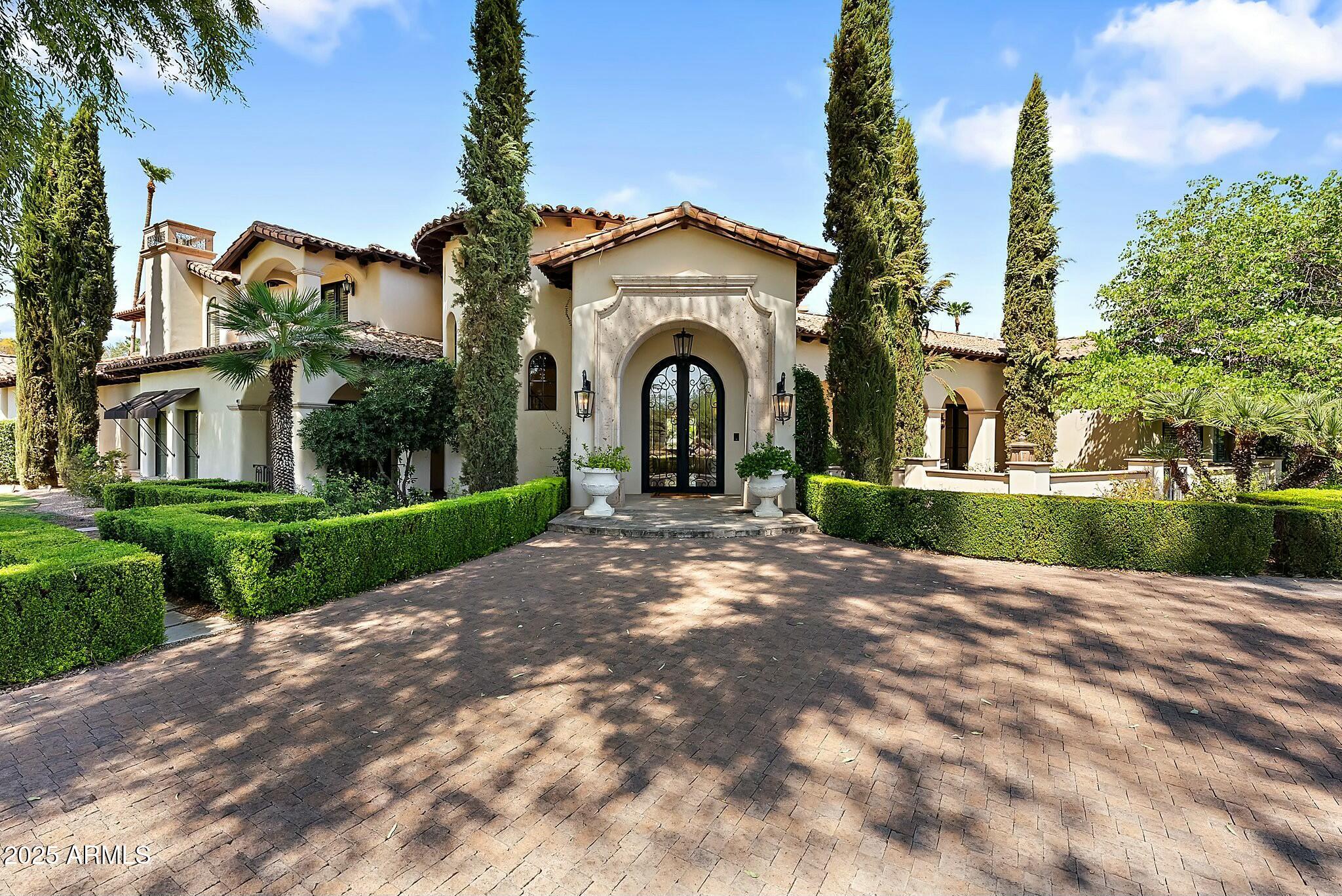 Located in Camelback Country Club Estates, 6800 E Caballo Drive is a home where craftsmanship and attention to detail elevate every space, showcasing Tom Argue's timeless design. With 7,763 square feet of living space, this home blends quality, elegance, and unique architectural details that distinguish it from typical new construction. As a local architect recently said, ''we just don't see them built like this anymore.'' The main level offers single-story living, with soaring ceilings and expansive windows that fill each room with natural light, creating an open and airy atmosphere. Quality and thoughtful design are evident in every room. The chef's kitchen features a large island, dual dishwashers, dual ovens, warming drawers, and premium finishes. A wet bar and 800-bottle wine room make it an ideal space for hosting. The family room flows seamlessly into the outdoor living areas, blending indoor comfort with outdoor entertainment. The detached 1,103 square-foot casita with private parking offers guests comfort and privacy. A staircase leads to a 1,000 square-foot retreat with two en-suite bedrooms and a bonus room, perfect for an office or quiet space, while maintaining the home's main-level living focus.

Designed with entertaining in mind, the home offers both formal and casual spaces. A main-level guest suite ensures privacy, and a home theater is ready for movie nights or watching the big game. The landscaped backyard features a pool and spa, covered patios, built-in BBQ, and mature landscapingideal for enjoying Arizona's sunny days and evenings in privacy.

Located in one of Paradise Valley's most sought-after neighborhoods, this home is surrounded by winding streets, perfect for walking and biking, and offers access to the area's natural beauty. 6800 E Caballo Drive offers a rare opportunity to own a home with unmatched architectural integrity and design.