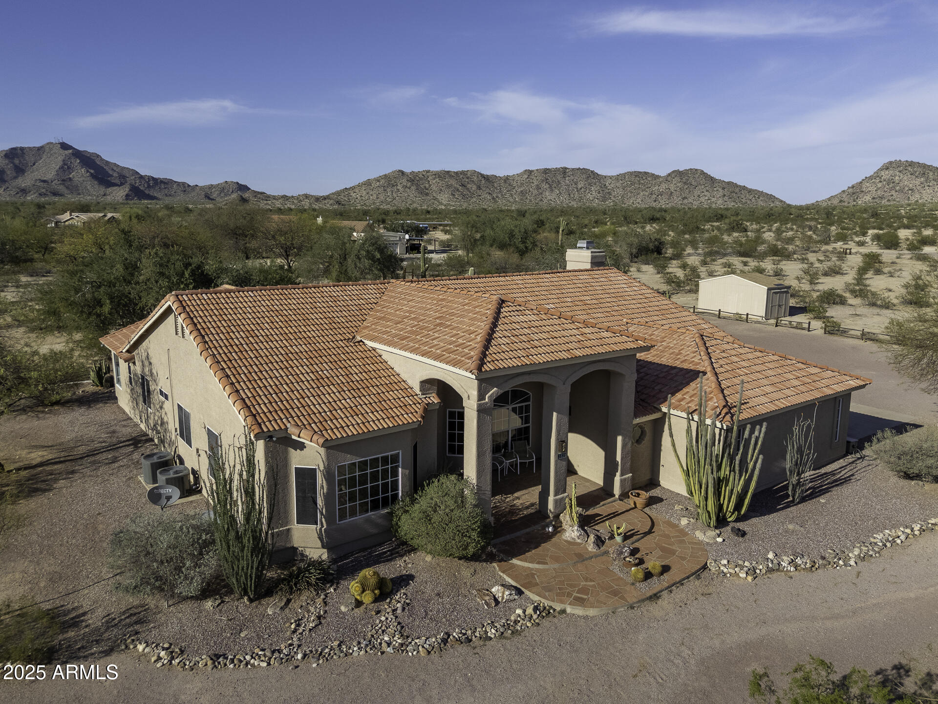 Come discover true desert living at this expansive and gorgeous property. Upon arriving you'll feel the intimacy of its unique and sought after location.  As you approach the front door you'll be welcomed with 4.17 acres of stunning mature cacti and desert trees as well as breathtaking mountain and city light views. This 3 bedroom plus office home boasts newer wood tile flooring, a sunken living room, upgraded bathrooms and chef's kitchen with walk-in pantry, double oven, large kitchen island and is open to the family room.  The primary bedroom has its own separate exit to the patio and the bathroom has a huge walk-in closet and a soaking tub where the views and wildlife can be enjoyed. Outside, sunsets and sunrises can be enjoyed from the patio or deck.  You'll also find an above ground swimming pool, "critter" fountain under an Ironwood tree, a fire pit area, 20 X 12 shed and an oversized 3 car garage.  All this and so much more space for endless possibilities in your own desert oasis.