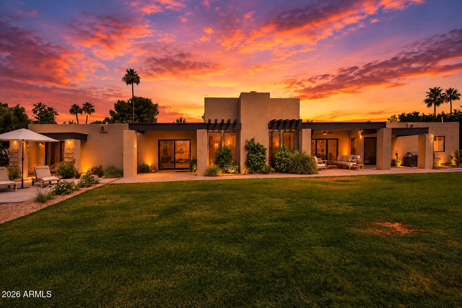 This modern home on the Wigwam Gold golf course has been fully remodeled and is loaded with timeless design elements. The split floor plan creates open spaces with tons of natural light, along with restored original beams, making this a rare find for golf course living.  It includes a gorgeous kitchen island with GE Monogram appliances, an oversized living room, private home office nook, and a fantastic primary suite with a tasteful bath. The exceptional finishes include hardwood throughout, custom cabinetry, marble and quartz, artistic tile accents, designer lighting, mirrors and finishes, and custom closet finishes.  The property features a spacious grassy yard, privacy tree lines, a large covered patio, and a courtyard with a gas fire pit taking advantage of the amazing mountain views.