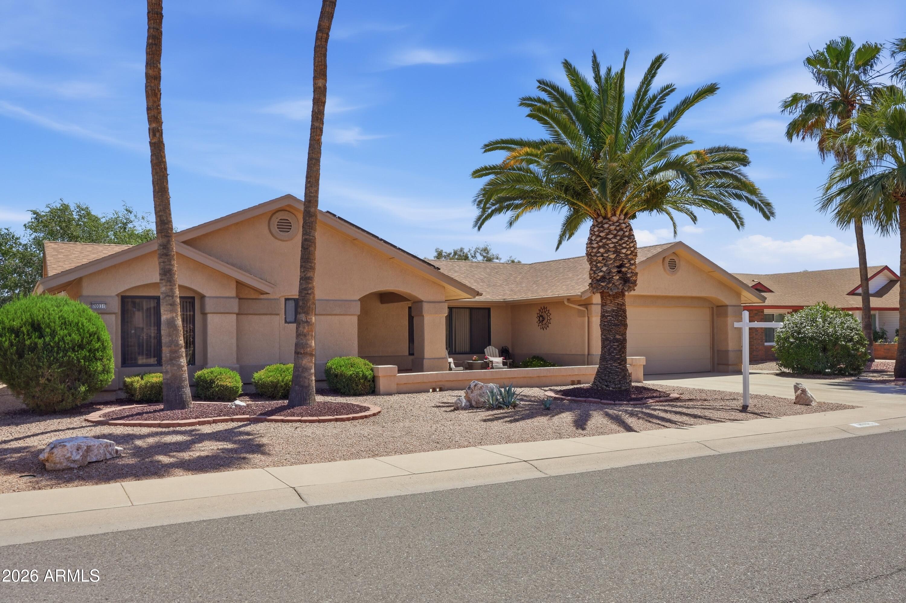 Experience the Sun City West lifestyle in this well-kept 2 bedroom, 2 bathroom home featuring an open, inviting layout and vaulted ceilings that create a bright and spacious feel. The expansive back patio is a true highlight... perfect for outdoor entertaining, relaxing mornings, or enjoying Arizona's year-round sunshine. Inside, the functional floor plan offers comfortable living and easy flow, ideal for both everyday use and hosting guests. Complete with a 2-car garage and low-maintenance landscaping, this home combines convenience with charm. Residents enjoy access to world-class community amenities including golf, pools, fitness centers, and a wide variety of social activities.