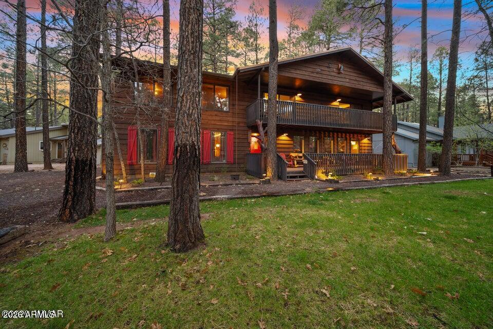 This incredible turn key mountain retreat offers the perfect blend of personal getaway and proven income opportunity. Previously operated as a successful vacation rental, this property is designed to comfortably host large groups while still feeling warm, inviting, and thoughtfully laid out. Spanning approximately 4,700 square feet, the cabin features 5 bedrooms and 3.5 bathrooms, including a convenient first floor bedroom, and comfortably sleeps up to 28 in beds. Each bedroom offers its own covered patio or balcony, creating a seamless connection to the surrounding tall pines and peaceful mountain setting. This incredible turn key mountain retreat offers the perfect blend of personal getaway and proven income opportunity. Previously operated as a successful vacation rental, this property is designed to comfortably host large groups while still feeling warm, inviting, and thoughtfully laid out. Spanning approximately 4,700 square feet, the cabin features 5 bedrooms and 3.5 bathrooms, including a convenient first floor bedroom, and comfortably sleeps up to 28 in beds. Each bedroom offers its own covered patio or balcony, creating a seamless connection to the surrounding tall pines and peaceful mountain setting. Designed with entertaining in mind, the home offers four spacious gathering areas, including a large great room, an expansive kitchen, a dedicated game room, and a theater space givin

giving everyone room to relax and enjoy. The game room with pool table is a standout feature, while the theater room creates the perfect setting for movie nights and group gatherings. The garage has been thoughtfully converted into a fully heated and cooled game room, while still offering the flexibility to be converted back to a garage if desired.
The kitchen is both functional and inviting, complete with stainless steel appliances, granite countertops, custom cabinetry, and plenty of room to cook and gather. An additional full size fridge and freezer in the climate controlled garage adds convenience for hosting larger groups.
Additional features include a large back shed for secure storage or use as an owner's closet, along with thoughtful upgrades such as multiple water heaters, a Ring doorbell camera, and dawn to dusk exterior lighting, enhancing both convenience and curb appeal.
With multiple decks, a fenced yard, and ample indoor and outdoor living space, this property is ideal as a full time residence, second home, or income producing investment.
The epitome of a mountain cabin, this one of a kind retreat is where lasting memories are made, with the added benefit of proven income potential already in place.