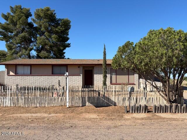 If you love country living, this is the hidden gem for you!  Situated on the out skirts of town in the rural area of the Desert Carmel subdivision.  It offers quiet living with all amenities just a few minutes away.  This 3 bedroom, 2 bath features a formal dining and large living room.  The laundry is off of the carport and the back yard has a nice size storage building.  Ideal home for someone that needs a little more privacy.