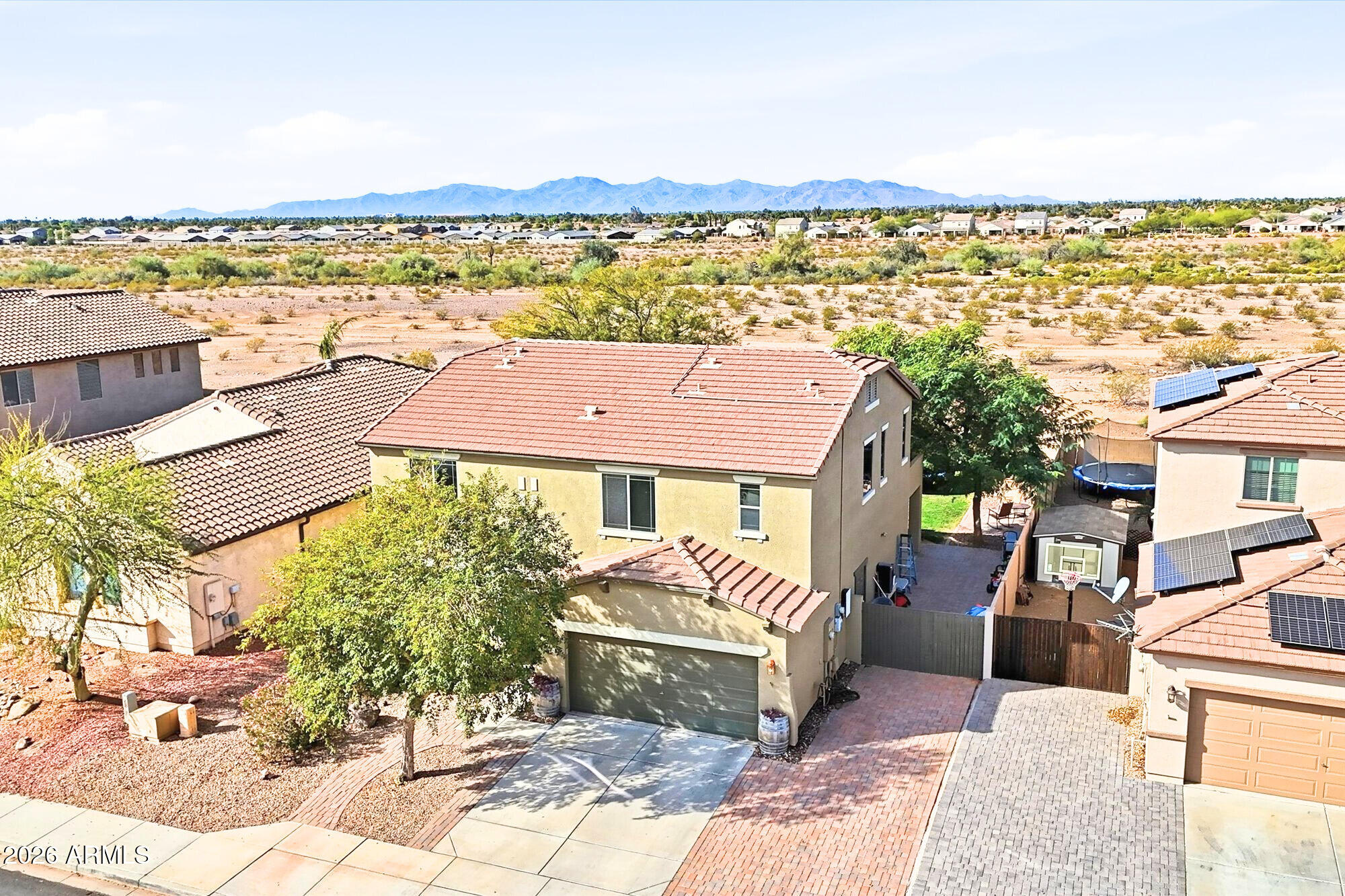 OWNED SOLAR! NEW AC! LARGE BACKYARD with NO BACK NEIGHBOR! RV GATE W/ EXTENDED DRIVEWAY in a NON AGE RESTRICTED community with PEORIA SCHOOLS! This home has it all including 4 bedrooms + first floor den/flex space + spacious loft. The gorgeous kitchen has been recently remodeled and is open to the dining area and living room with new custom fireplace with beautiful built ins! Enjoy the beautiful sunsets from your large backyard that you can appreciate without neighbors directly behind you. CrossRiver has multiple playgrounds, basketball/tennis courts, sand volleyball and is so much fun during the holidays! Close to the 303 with easy access to the TSMC complex, hiking trails, Paloma Park, Lake Pleasant and only a short drive away from the best restaurants and shopping of NW Peoria!