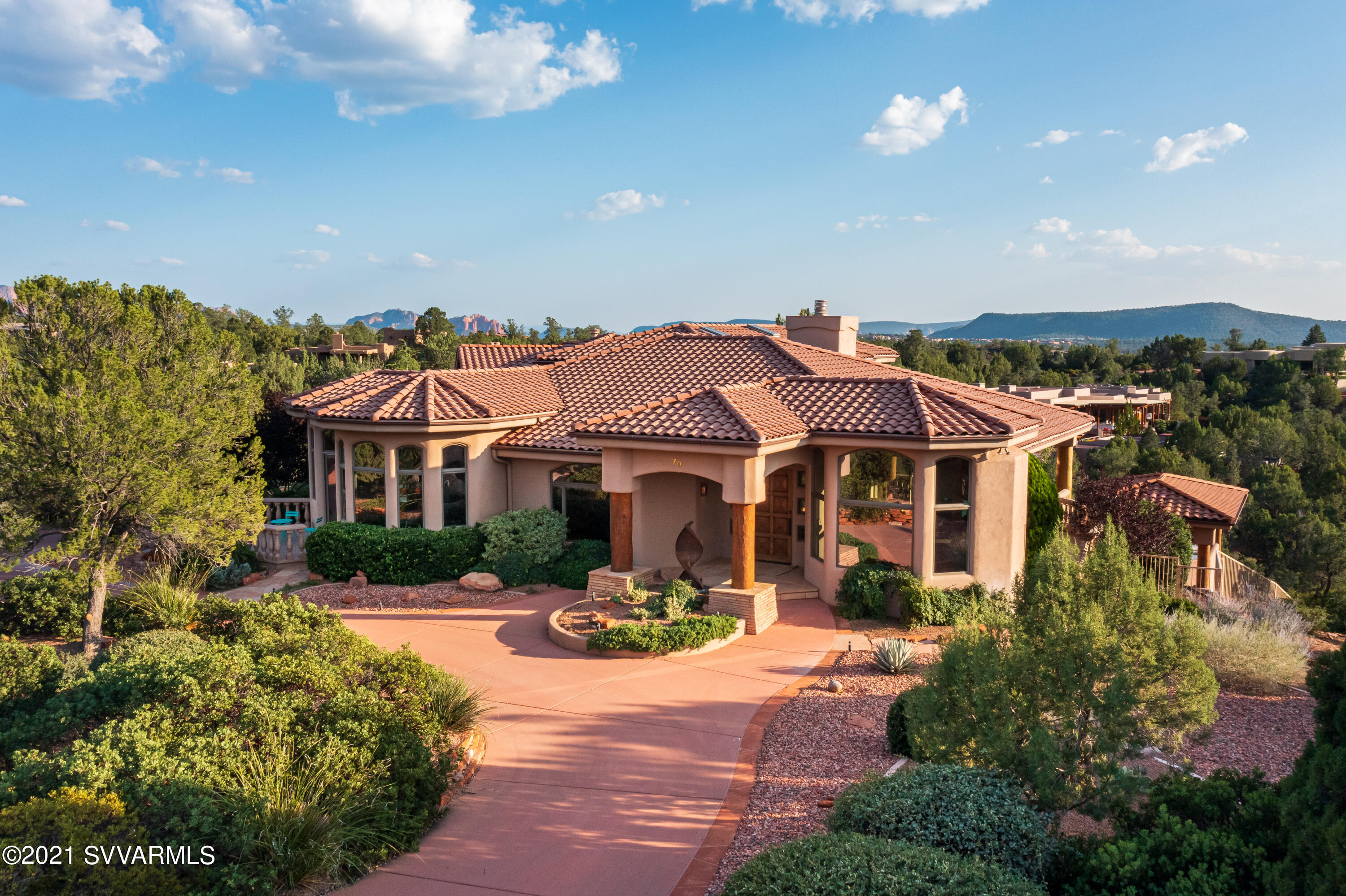 Southwest architecture meets Mediterranean classic style completing  the resort like atmosphere of  this privately located ,  multi-level, 4,616 sq ft home built on 2.05 acres.   Home has 4 bedrooms 4 baths & 866 sq ft casita.  Located  in gated community of North Slopes this home has the elegance & quality that you would expect from a luxury listing in Sedona.  Be sure to read the ''Special Features'' attachment to this listing to truly APPRECIATE this property.    Sunrise or Sunset, the views of Sedona's Red Rocks, from the interior or exterior will never disappoint.   This home is an entertainer's dream.    It starts with the Gourmet Kitchen, Media Room (with equipment),  spa, pool with dramatic water fall,  & numerous outside patios.  See supplement. Special touches include a heated towel rack & steam shower in the Master.  Office has two built-in desks & serious storage for books, printers, etc.  to support the owner who wants  to work from home.  This property has everything a new owner needs to live elegantly, as well as create memorable gatherings with family and friends.