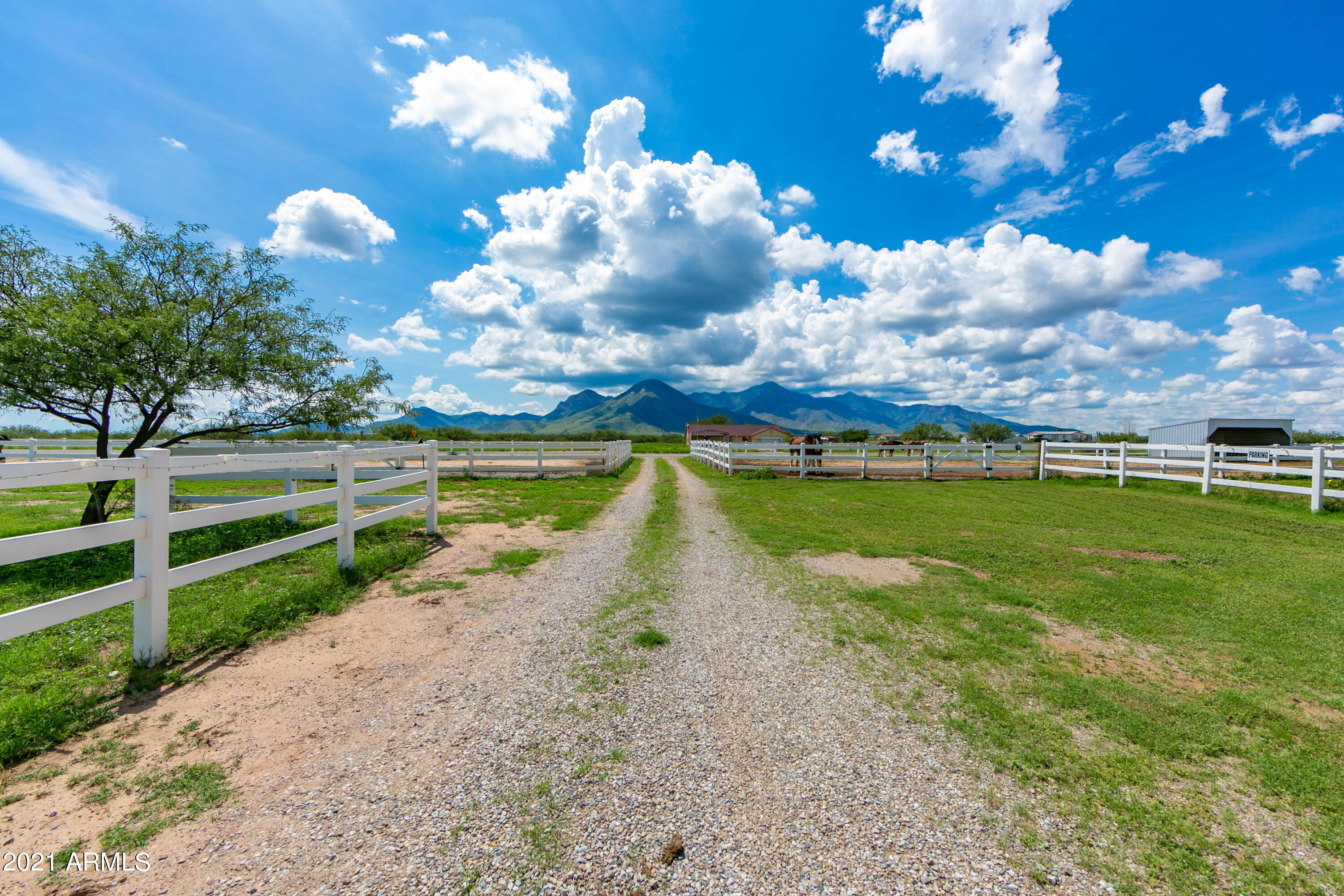 Saddle up and ride on over this gorgeous ranch. Sitting on over 10 acres  it is ready for you and your animals. The humans home is over 1900 square feet manufactured home with 2 covered patios and a covered porch perfect to look out to the unobstructed mountain views. The home is 3 large bedrooms and 2 bathrooms open living space including the spacious kitchen, dining area and family room. Step out side to the 8 horse stall, barn, shed, round pen and so much more. Panels will stay with the property to allow for any configuration you need for your animals. Everything you need to call it home. This is an opportunity that will not last!