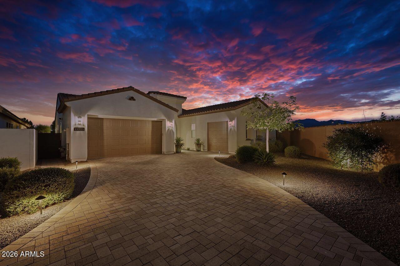 Welcome to luxury living in the award-winning Sterling Grove -- where resort-style elegance meets over $200,000 in custom designer upgrades. Perfectly blending sophistication, comfort, and indoor-outdoor Arizona living, this exceptional residence has been thoughtfully enhanced far beyond builder standards with premium finishes and breathtaking landscaping throughout.

From the moment you arrive, the curb appeal and meticulously curated exterior set the tone for what awaits inside. Step into a light-filled open-concept floorplan featuring upgraded flooring, custom lighting, designer fixtures, and high-end finishes at every turn. The chef-inspired kitchen is a true centerpiece, showcasing elevated cabinetry, premium appliances, oversized island seating, and luxury touches designed for both entertaining and everyday living.

The primary suite offers a private retreat with spa-inspired details, while the additional living spaces provide flexibility for guests, work-from-home needs, or multigenerational living. Every room reflects intentional craftsmanship and elevated design.

Outside is where this home truly shines. The professionally designed backyard oasis features extensive luxury landscaping, upgraded hardscape, premium outdoor living spaces, and a seamless blend of beauty and functionality -- creating the ultimate setting for entertaining, relaxing, and enjoying Arizona sunsets year-round.

Located within the highly sought-after gated golf community of Sterling Grove, residents enjoy access to resort-style pools, fitness center, spa, dining, pickleball, walking trails, and a championship golf course designed for an unmatched lifestyle experience.