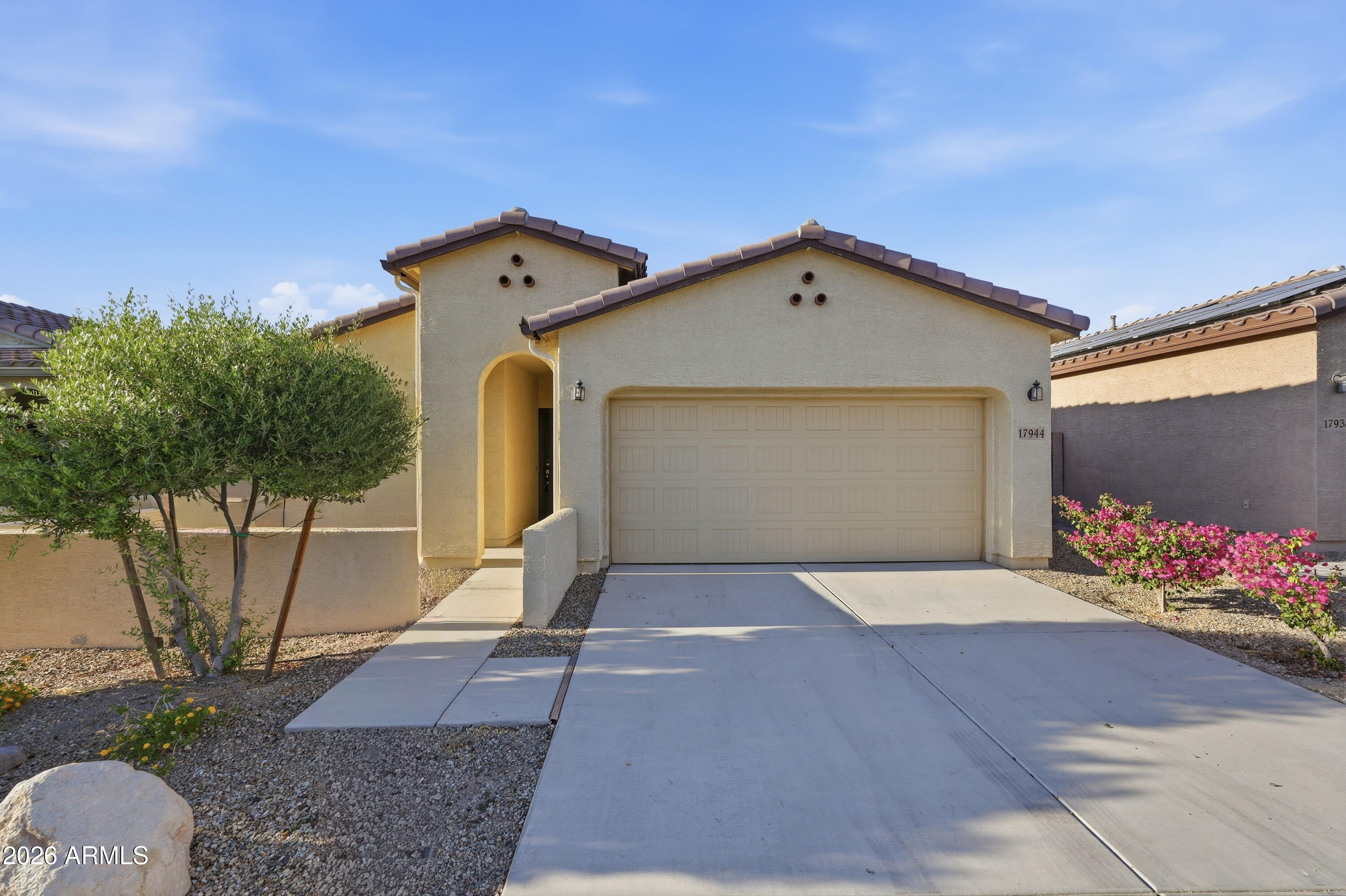 This delightful home is in the active-adult community of CantaMia in the Estrella Mountains. The property has 2-bedrooms, 2-bathrooms, granite kitchen countertops with a kitchen island, stainless steel appliances with electric stove and a soft water loop. The ensuite primary bedroom has dual vanities, walk-in shower and walk-in closet.  Guest bedroom has a single vanity, walk-in shower and walk-in tub.  CantaMia amenities include a clubhouse, art studio, demo kitchen, cafe/bar, tech & fitness center; indoor/outdoor pool, tennis, pickleball, putting green as well as numerous clubs,