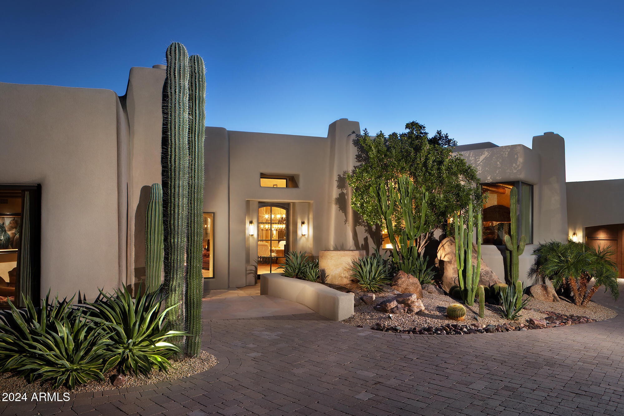Immediate Golf Club membership at closing. This artfully designed, Santa Fe inspired home offers rich & elegant detail with generous open living spaces and numerous fireplaces for comfortable gatherings 5,265/sf all on one level plus an upper level  721/sf two room Casita with view deck. Luxurious finishes and features include Venetian plaster, wood beam ceilings, center island kitchen with Wolf & Sub-Zero appliances, all bedroom en-suites, media room with large entertainment bar, fitness room, 4 car garage, BBQ, pool and spa. Desert Highlands amenities include Jack Nicklaus signature golf course, 13 tennis courts (4 grass), pickle ball courts, bocce ball courts, fitness center, fine & casual dining,walking paths, guard gated & security patrolled. Buyer pays $205K Membership Fee at COE.