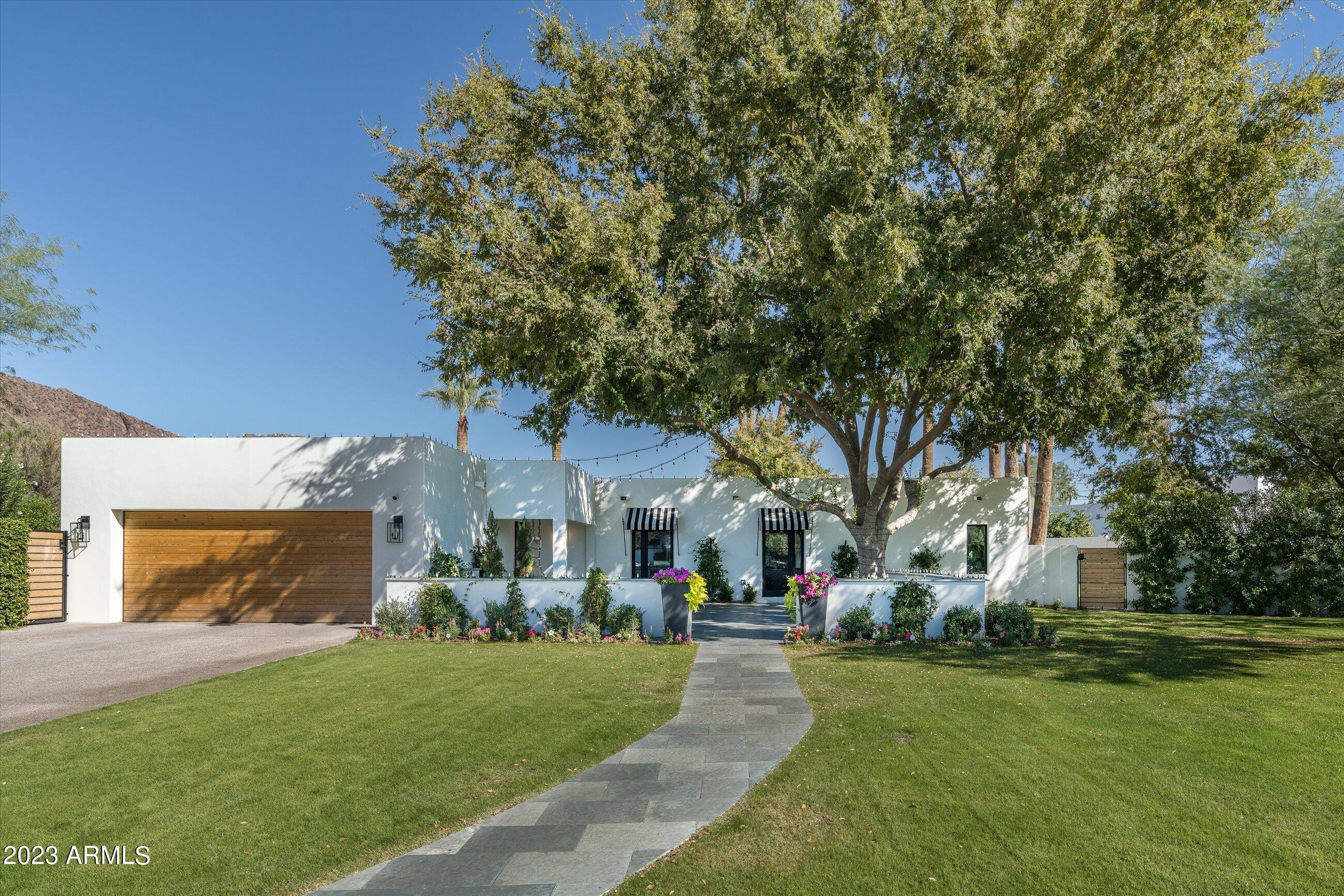 Nestled at the base of a private Cut de Sac in the heart of Arcadia Proper, this gem of a remodel is a rare find today's market. Featuring 5 bedrooms / 3 baths / bright open split floor plan on newly a half acre of captivating outdoor living spaces for your year round enjoyment. The expansive backyard with towering mature palm tress assist in capturing the surrounding beauty and Camelback Mountain views. For those of you who don't yet know ARCADIA, this neighborhood is Arizona's most prized location and the epicenter of top tier schools, fine local dining, world class resorts and boutique shopping. High in demand and offering an unparalleled blend of suburban tranquility and urban energy - you won't want to miss this one of a kind opportunity.