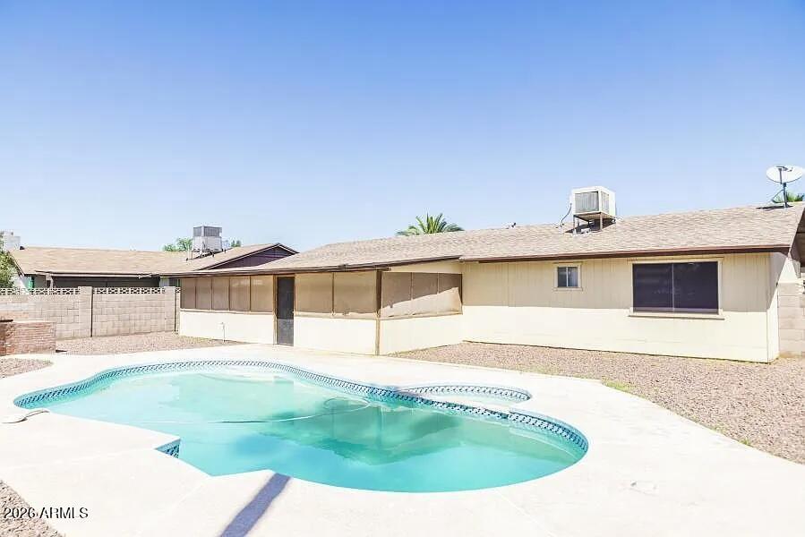 This is the perfect home to cool off in this summer in your very own backyard with private swimming pool &  spa and a built in BBQ for outdoor cooking. With both indoor and outdoor living areas you can relax in the large Arizona room or head in to your charming single level 3 BR home situated in one of Peoria's established neighborhoods with excellent schools and parks close by. Mark this one as your favorite and come see it today  : )