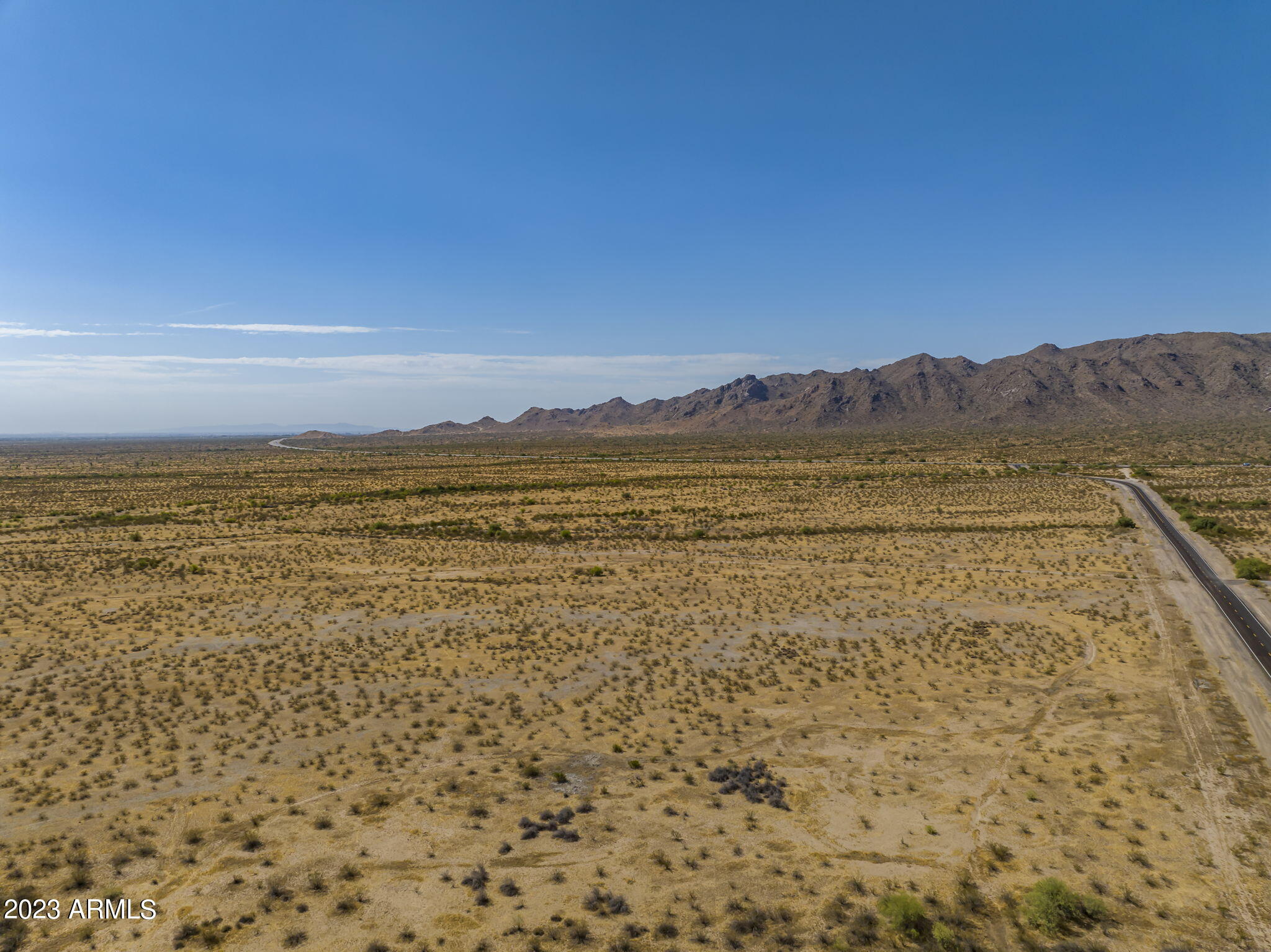 Approximately 22 miles from the TSMC plant & approximately 1 mile East of Mesquite Mountain Ranch Subdivision that is under construction; There are tentative plans for 211th Avenue to be an access road between White Tanks Freeway & Sun Valley Parkway. Located at approximately 211th Avenue & Beardsley and just less than a mile north Sun Valley Parkway; Planned Area Development (PAD) Surprise Special Planning Area 3 (SPA3) ; The current grazing lease puts the property in the legal class of AG (02-OR) Section/Town/Range 25/4N/3W Legal Description NW4 NE4 NE4
