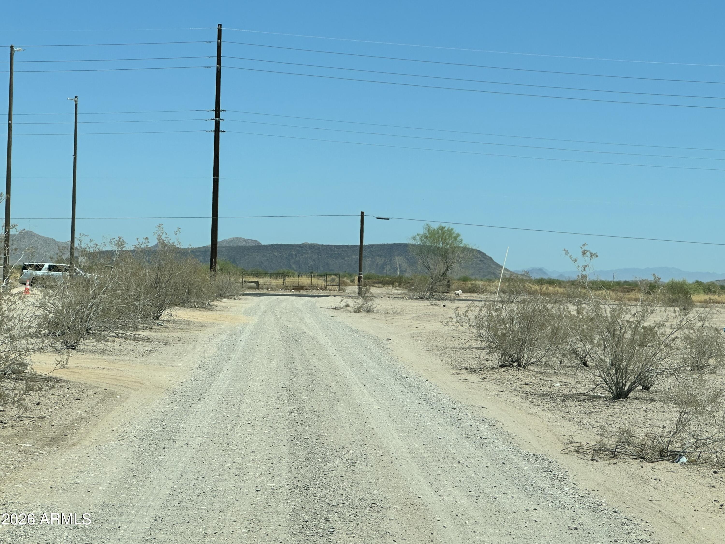 Capitalize on this premium, newly split 1-acre parcel in Tonopah! Boasting breathtaking, unobstructed mountain views, this lot features completely flat, 100% usable topography with no washes or drainage encumbrances to complicate your build, just off paved Indian School Rd.. Whether you are looking to build a custom estate, or hold a strategic land investment, this parcel is ready for your vision.Enjoy easy access via paved road frontage with power located in close proximity. Survey is in doc tab. Buy a single 1-acre homesite, or acquire adjacent lots to create a larger private compound. No Bank Needed: Skip the lending hassle with attractive, flexible Seller Financing terms tailored to your strategy.