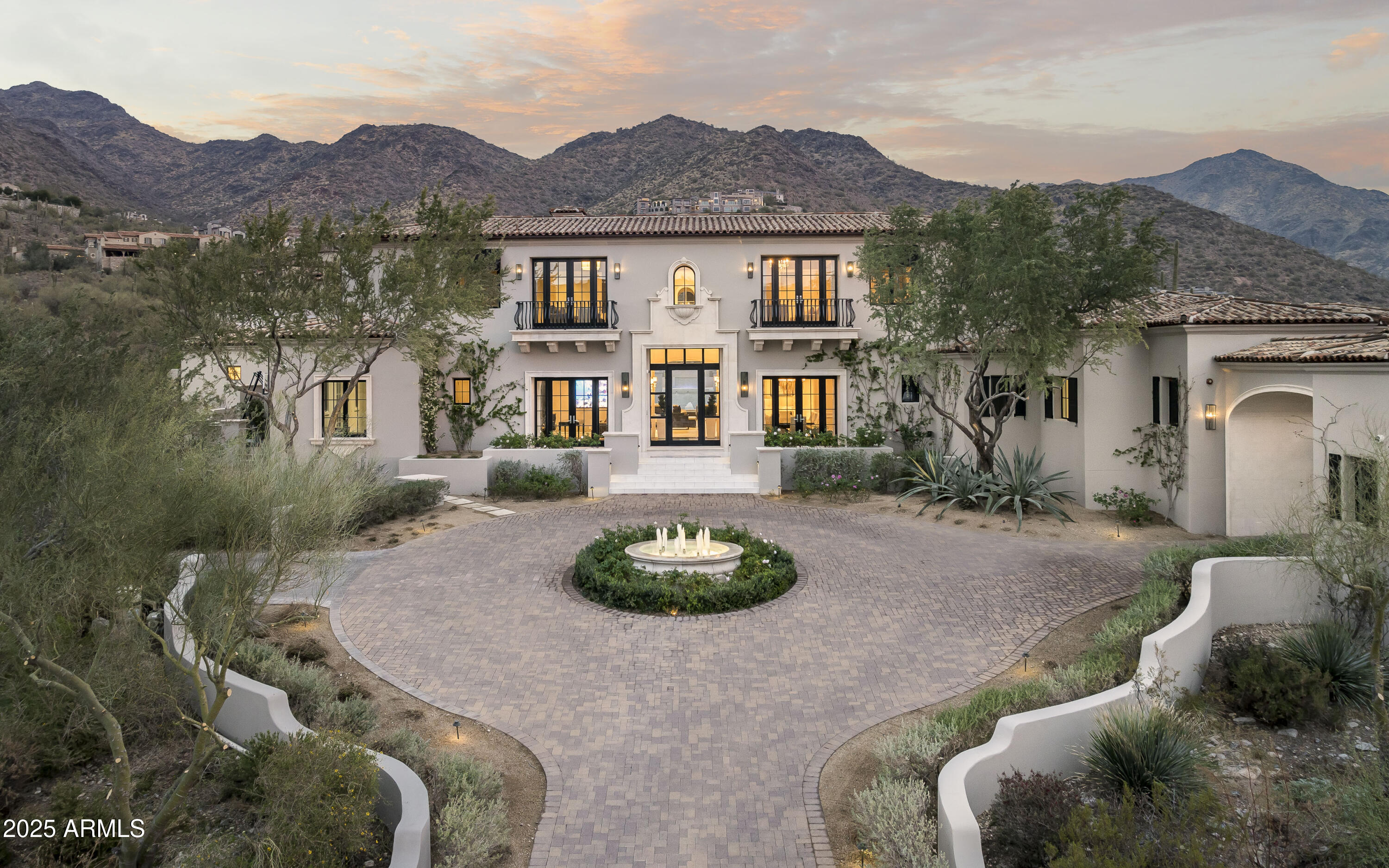 This timeless Modern Mediterranean estate is located on a quiet cul-de-sac in the heart of Silverleaf's prestigious Upper Canyon.  HOME IS BEING OFFERED FULLY FURNISHED.  Captivating views are found in every room, capitalizing on its 2250' elevation and unique mountain setting. This recently refreshed grand residence is the ideal size encompassing 8,889 square feet of indoor livable space in addition to sprawling outdoor living areas. The superb interior styling, orchestrated by Donna Vallone of Vallone Design, creates the perfect blend of casual luxury with a sophisticated modern edge. The house was designed by architect Luis Antonio Bonilla owner of the Antigua Home Designs. The main level living offers a large Primary retreat with spa-like bathroom, a private guest suite, luxurious office, spacious living room with bar area, grand soaring ceilings and pocket doors seamlessly blending the indoor and outdoor. The second-floor features two oversized guest suites. This estate home was built to the highest standard of quality and detail by Argue Custom Homes. Quality finishes throughout include the gourmet kitchen with Wolf/Subzero appliances, wide plank wood flooring, crown moldings and custom ceiling detail, extensive home automation system, back lit wine wall and private Office. Outdoor living spaces include a large covered rear patio in addition to two separate ramadas, a BBQ center, heated pool/spa and extensive turf. The immaculate and spacious 4 car garage including a custom show garage is yet another highlight. This home is a rare find in the neighborhood due to its combination of size, styling and views. 

Silverleaf, located in North Scottsdale, Arizona, is a prestigious guard gated community known for its luxurious estates, exclusive golf courses, private Club and stunning desert landscapes. The Tom Weiskopf-designed Silverleaf Golf Course is a highlight for golf enthusiasts. With a blend of Spanish and Mediterranean-inspired architecture, the community offers a high standard of living, including upscale amenities like spas, fine dining, and exclusive shopping. Residents enjoy a harmonious balance between modern luxury and the natural beauty of the desert environment, making Silverleaf a sought-after destination for those seeking an exceptional lifestyle in North Scottsdale.