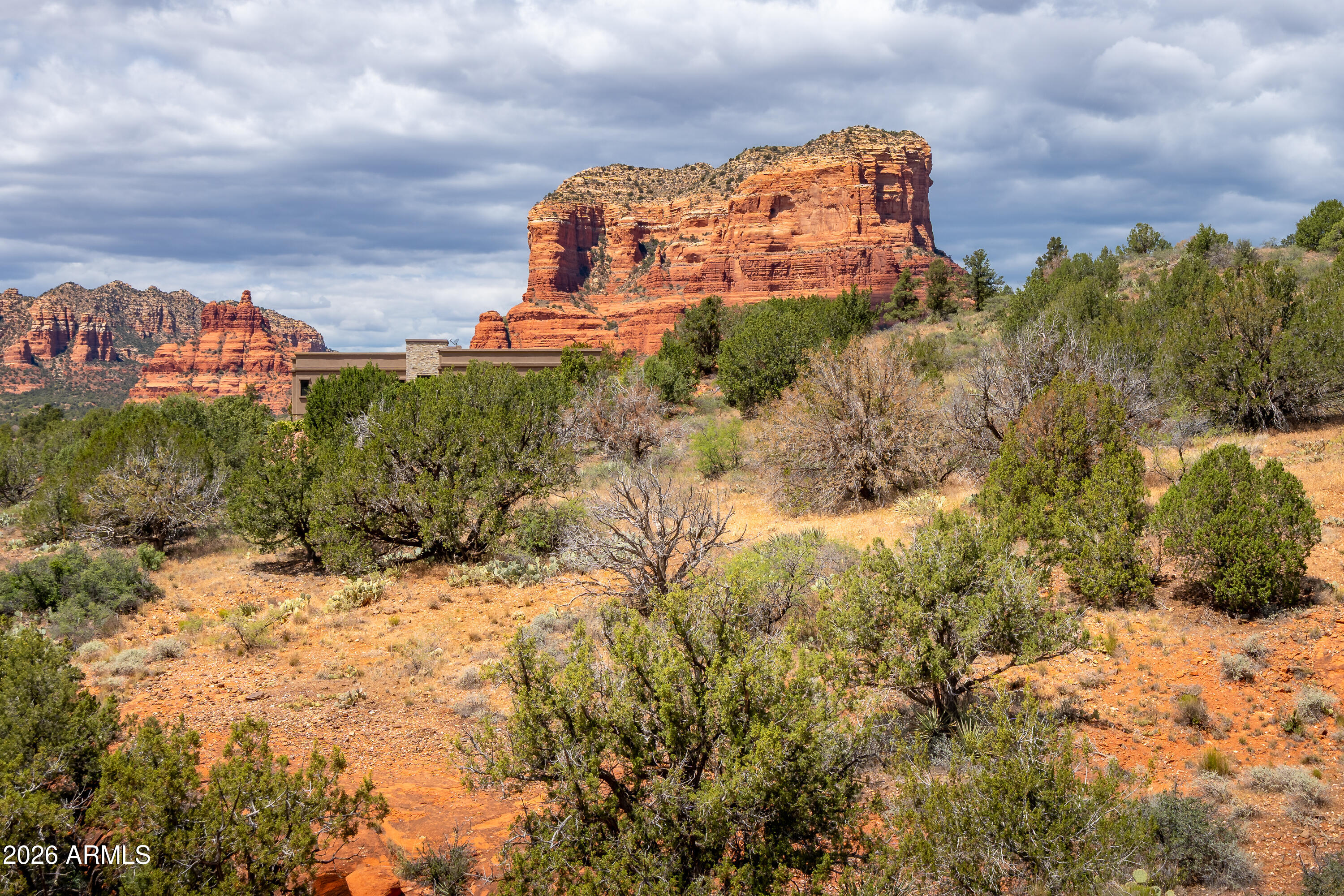 Luxury Red Rock Estate in Sedona
Discover unparalleled beauty on this 4.58-acre gated estate, surrounded by red rock views from every angle. Wake to breathtaking vistas of Bell Rock, Court House Butte, and Lee Mountain--an exclusive setting among Sedona's premier residences.
Architectural plans for a custom retreat designed to blend seamlessly into the stunning red rock formation are included, or choose your own site within the expansive land. The property features detailed drawings, septic systems, and permits, all conveying with the land.
This is a rare opportunity to own a private, luxurious sanctuary amid Sedona's majestic landscape--where tranquility, privacy, and natural beauty converge.