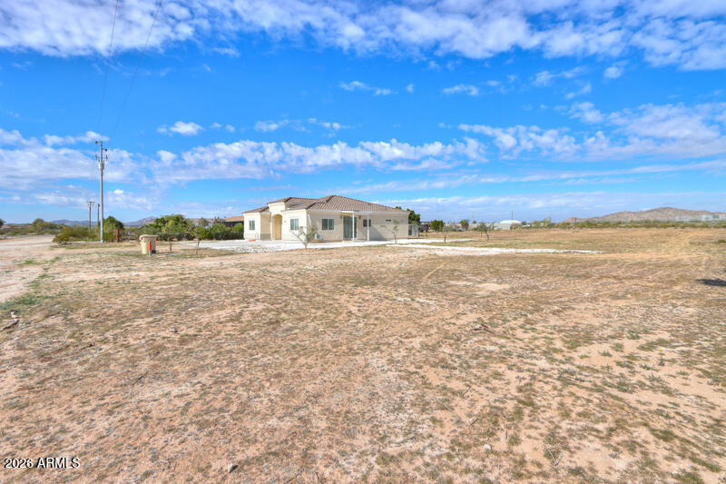 2024 BUILD on 1.25 ACRES with 2 PRIMARY SUITES!  Beautiful 4-bedroom 3-bathroom residence offers an open concept floor plan with modern finishes throughout. Vaulted ceilings & plank tile floors compliment the amazing kitchen that showcases a huge island, white shaker cabinetry with black handles, quartzite slab counters, glass tile backsplash, Samsung stainless steel appliances, single basin SS sink with spring pulldown sprayer faucet & large walk in pantry. Spacious family room is open to dining in great room with additional wall mini split.  Walk in closets in all bedrooms. Lovely on suites feature floor to ceiling tile showers. In door laundry room, tankless water heater, covered patio, shed & partially fenced perimeter make this property a rare find with endless possibilities!