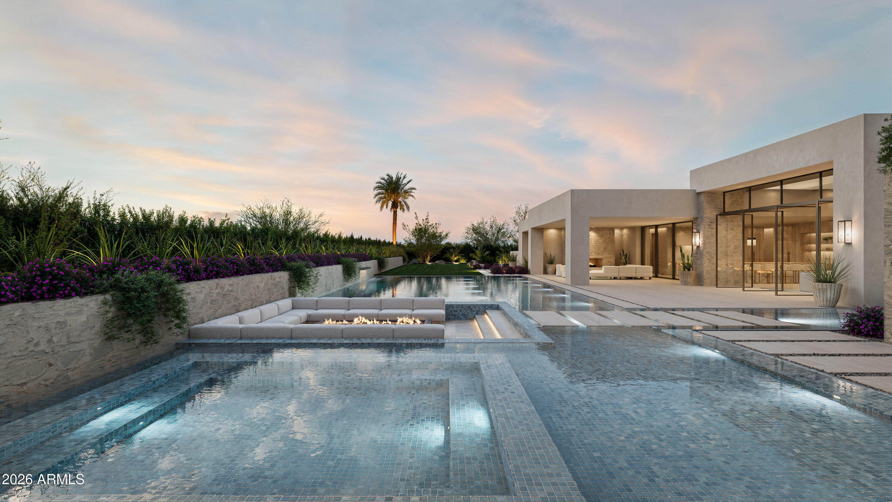 A striking expression of contemporary desert luxury, this newly constructed estate is set to debut in October 2027. Designed by renowned architect Stratton Andrews w/ interiors curated by acclaimed designer Holly Wright, the residence blends bold modern architecture w/ refined natural materials to create a home that is both dramatic and deeply inviting. While construction is still in the early stages, buyers may have the opportunity to personalize select finishes and design elements, allowing for a bespoke living experience tailored to individual taste. The 6,045 sq ft main residence is thoughtfully composed w/ clean architectural lines, expansive walls of glass, and curated textures that create a seamless connection between indoor and and outdoor living. A 1,010 sq ft detached guest home provides private accommodations for visitors, extended family, or a sophisticated work-from-home retreat. Outdoor living takes center stage with a spectacular heated pool and infinity edge spa w/, tranquil water features, and a sunken fire pit lounge designed for intimate gatherings beneath the Arizona sky. A welcoming courtyard with its own fire pit creates a dramatic entry and an additional outdoor entertaining space. Enjoy Control4 smart home automation, a 5-car side-entry garage, and expansive patios designed for effortless entertaining. Ideally located in the heart of Paradise Valley, the home offers close proximity to world-class golf, fine dining, and luxury shopping, while maintaining privacy.