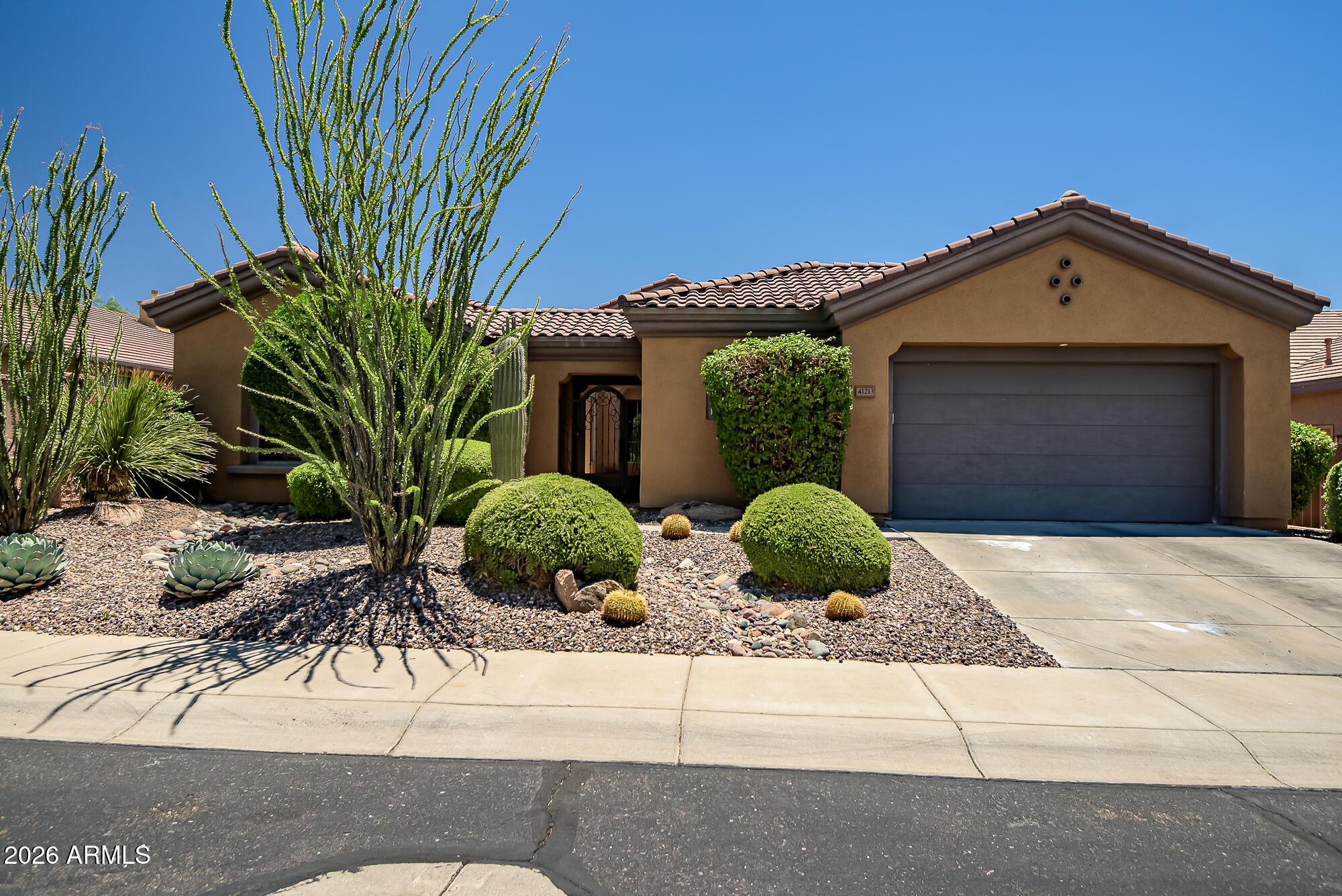 Perched on Ironwood #9, the views here are the real showstopper -- golf course, mountains, and city lights at night, all from inside and out. Step through the iron gate into a private courtyard with a separate casita entrance, then walk in and instantly get it. The Tacoma model gives you room to make it your own. The kitchen has a skylight, granite countertops, stainless appliances, -- actually built for someone who cooks. The family room is big enough for everyone, shutters throughout, and a large covered patio that becomes your third living space. End the night in the backyard watching the city light up. Anthem Country Club brings the rest -- 36 holes of championship golf, tennis, pickleball, two pools, two fitness clubs, and two restaurants. Resort living without the hotel checkout.