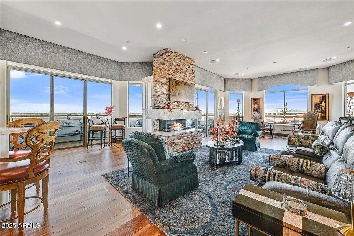 This is your opportunity to live at The Top Of The Landmark in a 7th floor Luxury Penthouse. The  7th floor allows panoramic mountain views that we all want...but only a few have. This corner penthouse unit provides unparalleled privacy and exclusivity and offers gorgeous views of the Westin Golf course with stunning sunsets. MOVE IN READY with many updates and newer finishes like hardwood floors, automated blinds, interior paint, LED lights, fixtures and much more. Three new 18 seer air conditioners, a new water leakage  system, and remote control A/C & heating controls will give you year round peace of mind for years to come. A luxury kitchen with Wolf, Sub-Zero, and Miele appliances. 11 foot ceilings and 3 balcony patios enhance your everyday living. Owner privileges include 2 covered parking spaces directly adjacent to the elevator, 1 enclosed garage, a spacious storage unit. Each owner also has the use of a designated wine locker as part of ownership privileges.