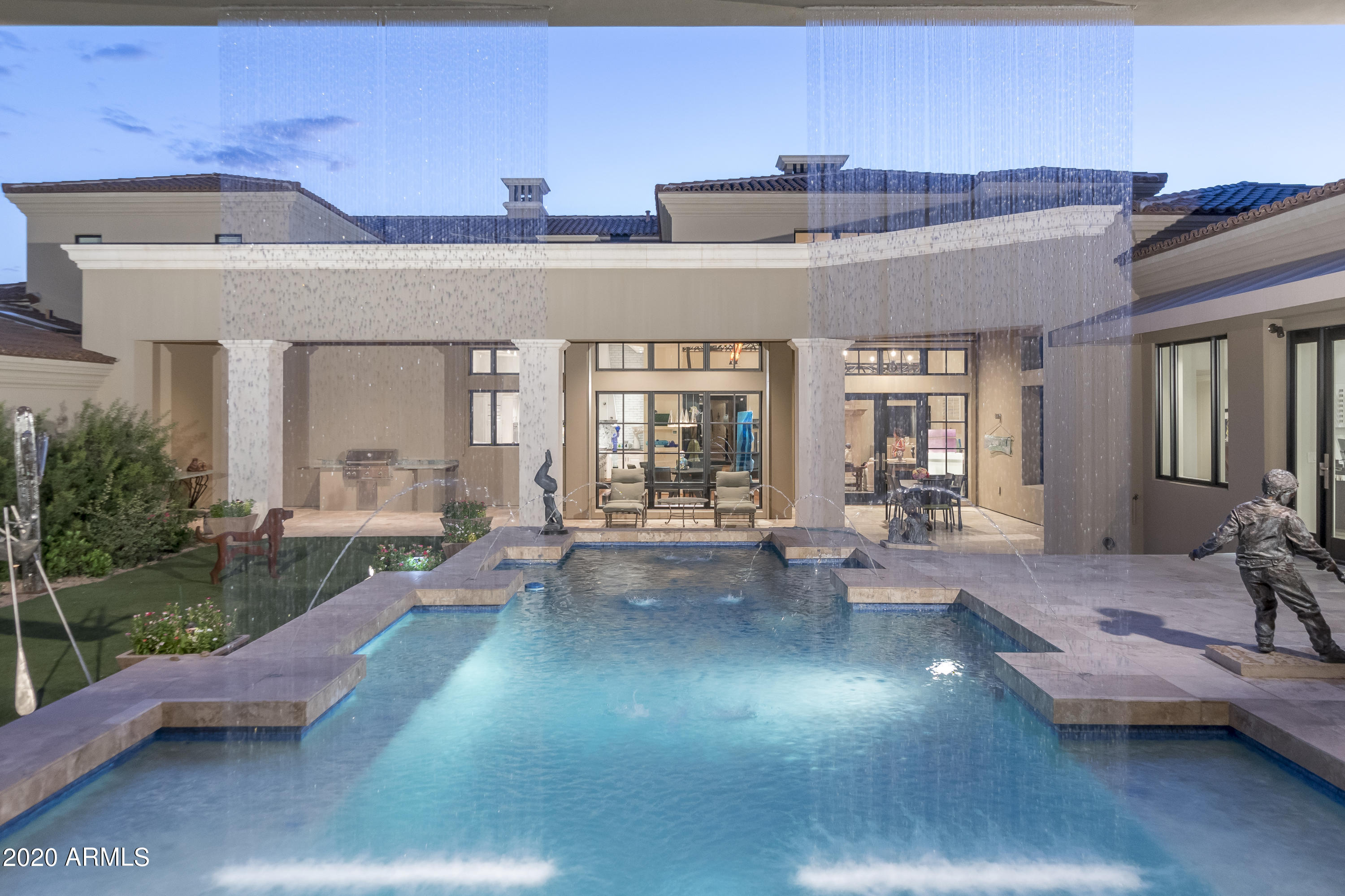 A magnificent Custom home in the heart of Horseshoe Canyon in Silverleaf. Privacy is the element that makes this home uniques. Carefully crafted architecture surrounds the private spaces of this home allowing for intimate outside living. Interior elements are constructed with care and pride. Herringbone wood floors, detailed ironwork and elegant touches are everywhere. A home crafted for art collectors and those that wish to feel spoiled. The guest wing has 3 full oversized bedrooms each with their own bath, An office wing of over 800 square feet can easily be converted into another primary Master suite. This flex area compliments the other wing. The  secluded master enclave upstairs allows for ultimate  privacy. The elevator delivers you conveniently from the master into the laundry below Just a moments walk from your front door to the entrance of the Silverleaf Clubhouse and all their amenities. Privacy, elegance and opportunity.