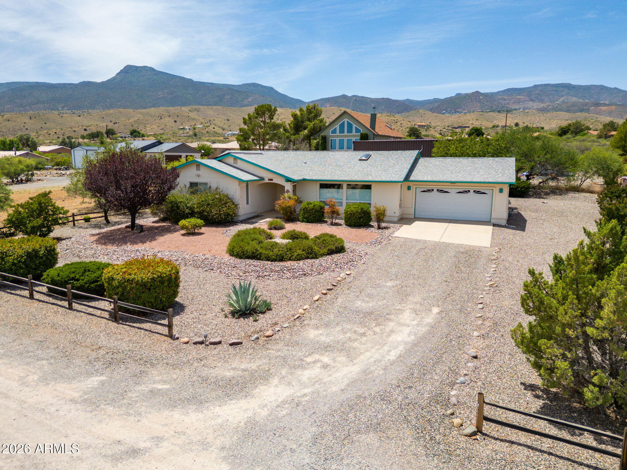 Red Rock views of Sedona from the front of the home create an immediate sense of calm and openness. Large front windows bring those views into the main living area, where vaulted ceilings, skylights, and natural light give the home a bright, comfortable feel. Set on a nearly half-acre lot with mature landscaping and low-maintenance hardscaping, the property offers space, trees, and an easy-care exterior that feels different from a standard subdivision lot. Inside, the home feels solid, clean, and well maintained, with generous living space, a large primary suite, comfortable secondary rooms, and a screened Arizona room. Prepaid leased solar is already in place, adding a meaningful ownership benefit while the home offers room to update over time.