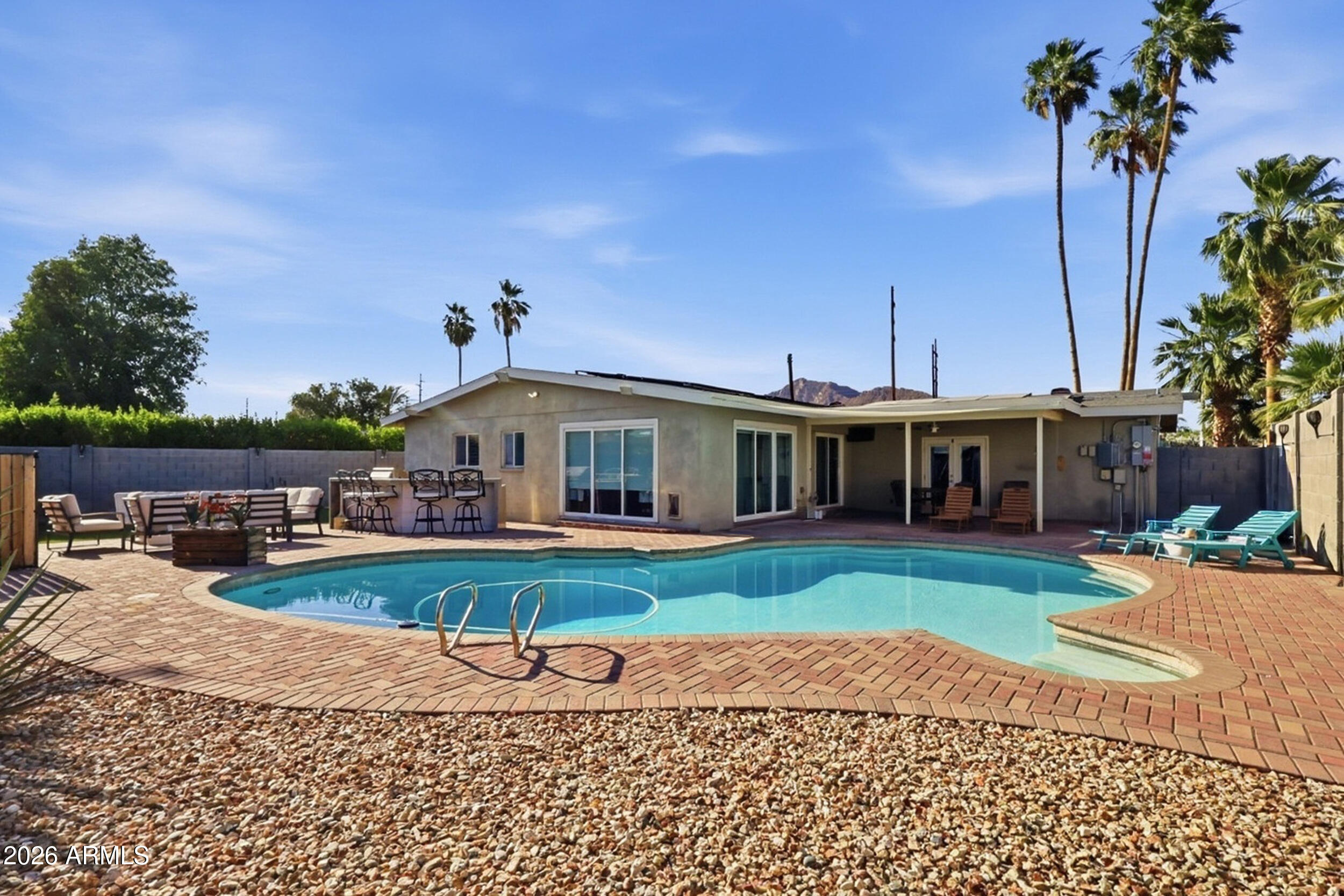 Turnkey Scottsdale retreat offering the perfect blend of lifestyle and investment potential. Ideally located just minutes from Old Town Scottsdale, world-class dining, golf, spring training, luxury resorts, shopping, hiking, and the vibrant entertainment district, this fully furnished and active Airbnb is ready to enjoy from day one.
Designed for both personal use and guest appeal, the 3-bedroom, 2-bath split floor plan features an oversized primary suite with a spacious walk-in closet, multiple gathering spaces, game area, RV gate, and an XL garage storage room for bikes, golf clubs, and outdoor gear.
The resort-style backyard is an entertainer's dream with a diving pool, built-in BBQ, putting green, and breathtaking Camelback Mountain views--creating the ultimate Scottsdale vacation. Guests can bike the nearby canal to Arcadia, explore renowned golf courses, or enjoy Arizona's endless outdoor recreation.
Whether you're seeking a lock-and-leave second home, a 1031 exchange opportunity, or a proven short-term rental investment, this income-producing property offers immediate enjoyment and exceptional flexibility. All furnishings, décor, and contents convey, making this a truly turnkey Scottsdale opportunity.